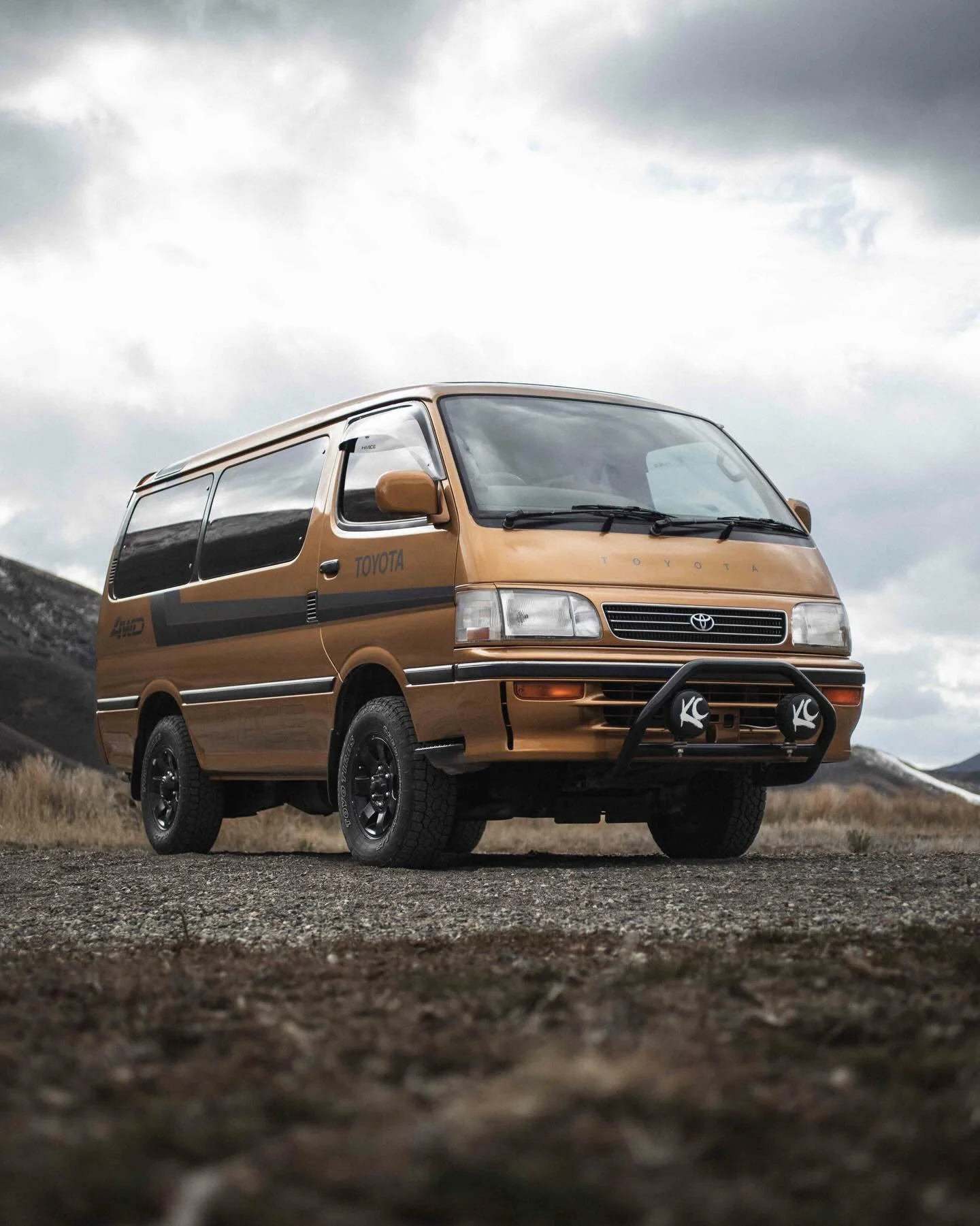 Meet Dorado &mdash; a 1996 Toyota HiAce finished in Tiger Eye Pearl and powered by the legendary 3.0L 1KZ turbo diesel. With 240,857 KM and full-time 4WD, this van is built to keep going. It rides on 28&rdquo; Toyo Open Country A/Ts with 15&rdquo; bl