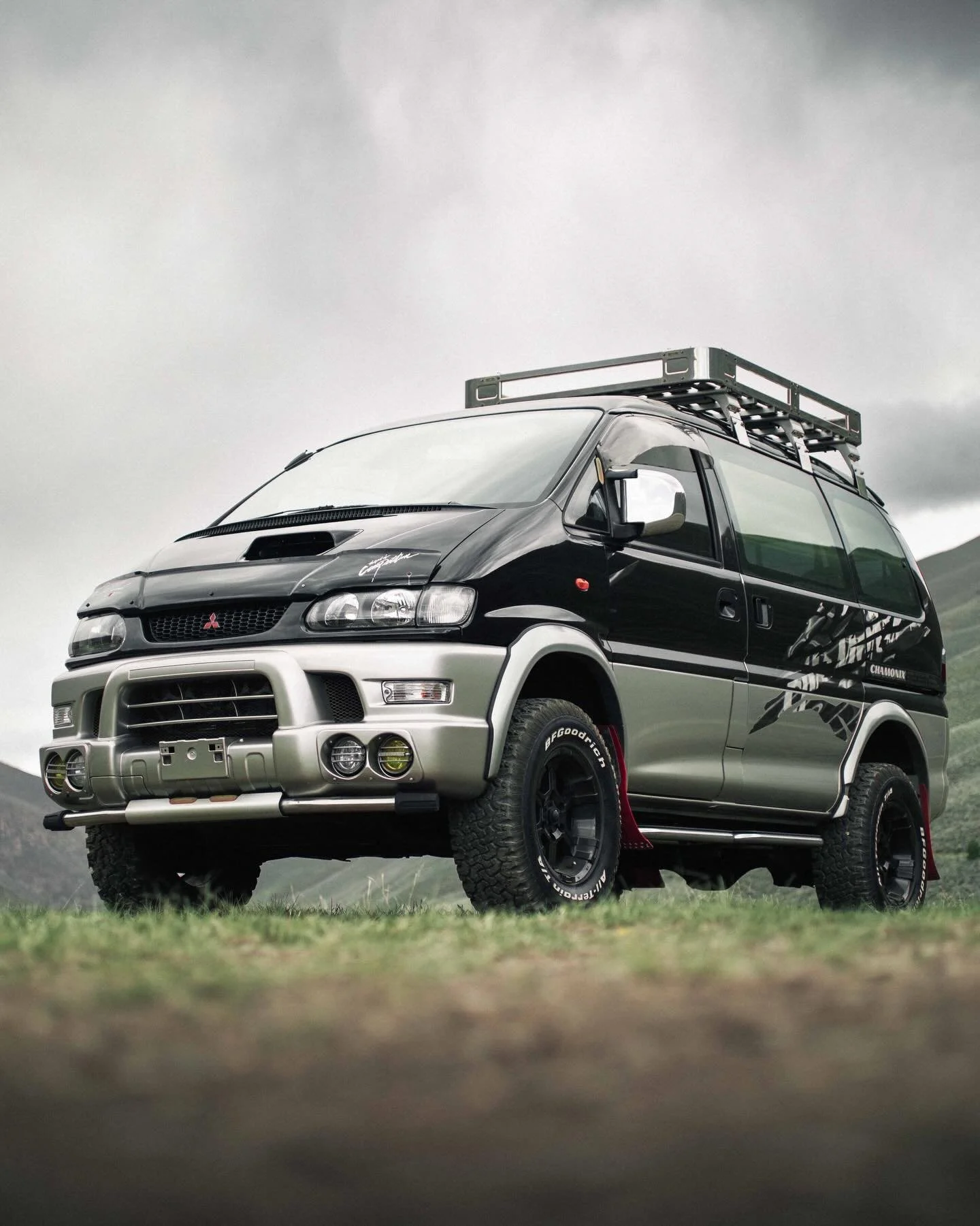 Enter SCARAB &mdash; a 1997 Mitsubishi Delica L400 Space Gear Chamonix with a dark two-tone finish and a stance built for getting lost on purpose. Powered by the dependable 2.8L 4M40 turbo-diesel, Scarab combines selectable 4WD high/low, a center loc