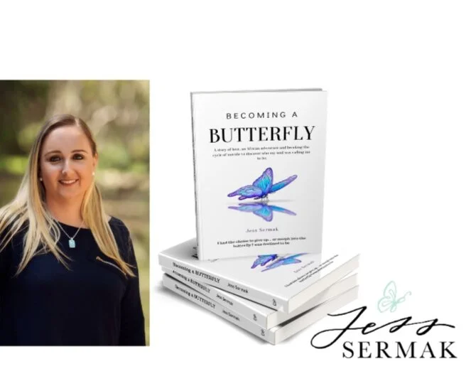 Book titled 'Becoming a Butterfly' by Jess Sermak with a blue butterfly on the cover, positioned next to a woman with long blonde hair, wearing a black top and necklace, standing outdoors.