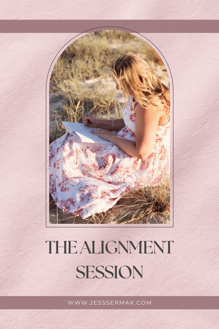A woman with wavy blonde hair sitting on sandy ground in a field of tall grass, writing in a notebook.