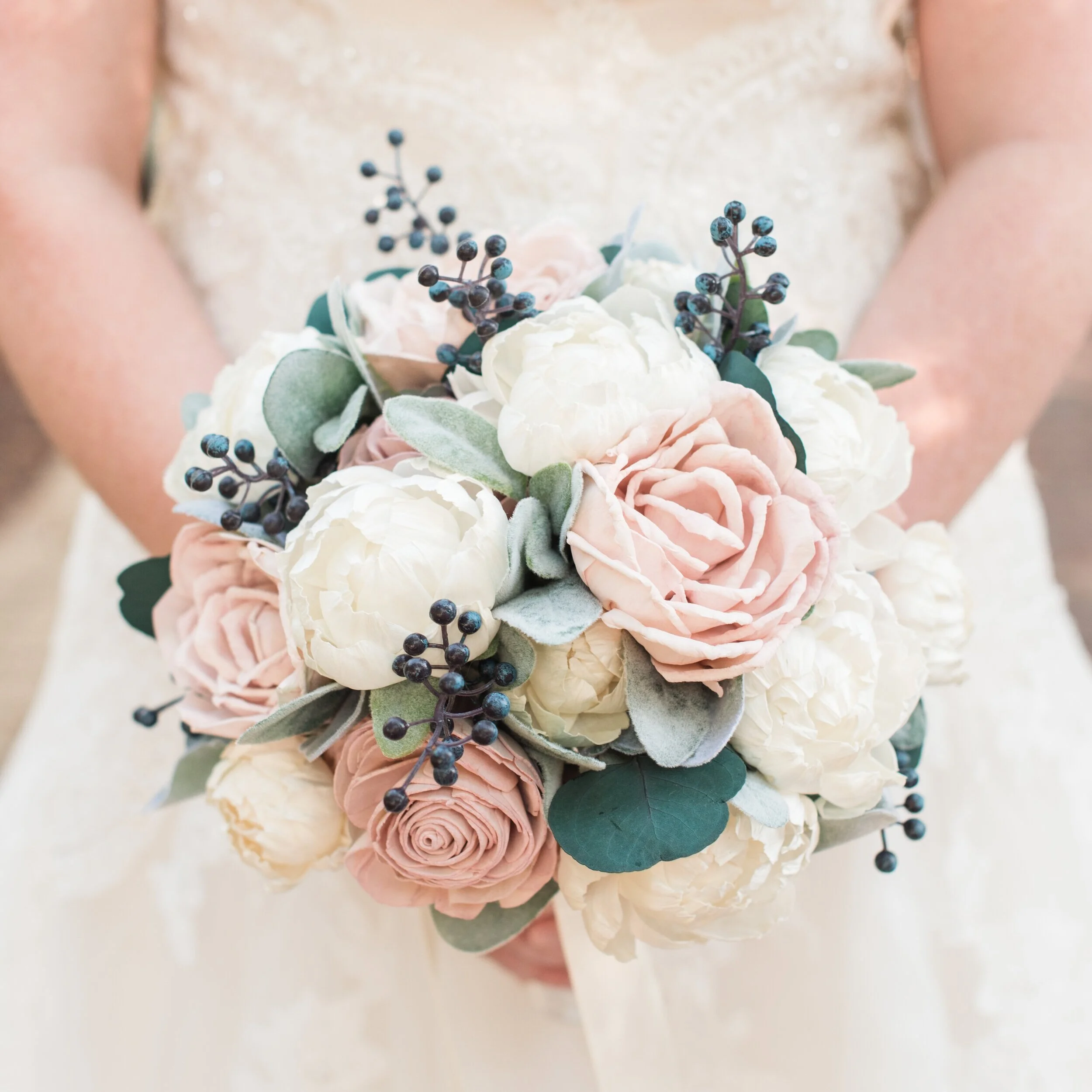 Wooden bouquet with white and rose-colored flowers and pops of green and blue