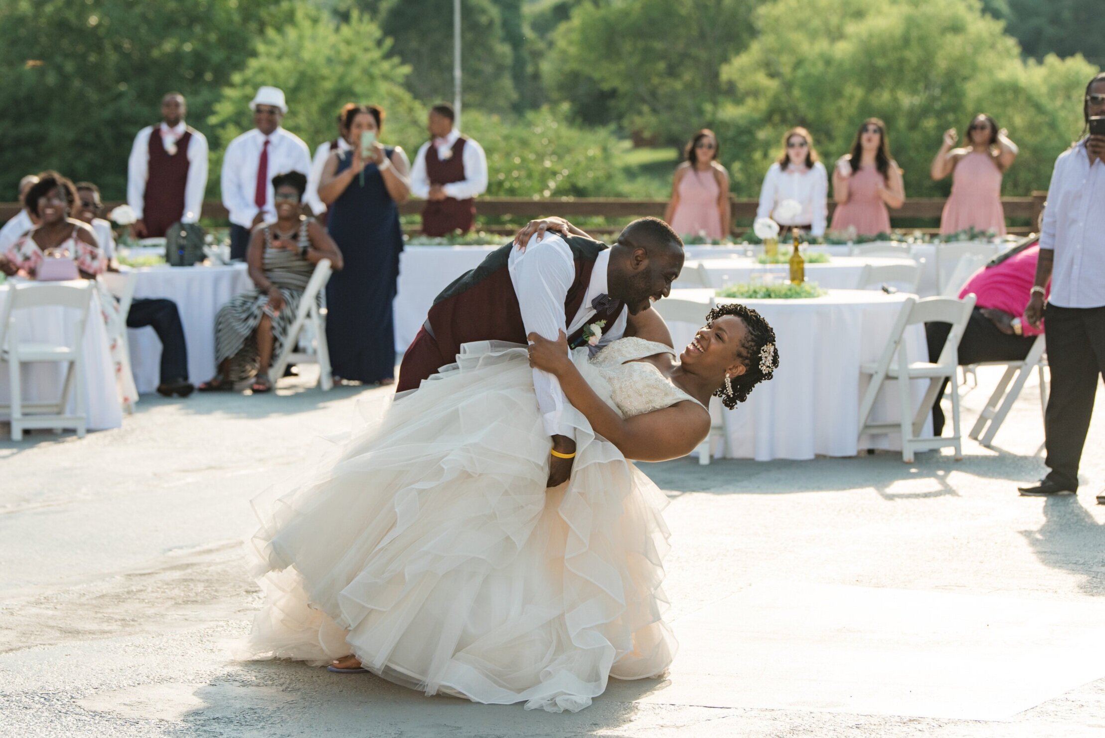 A couple share their first dance and show off a beautiful dip at the Barn at Cranberry Creek