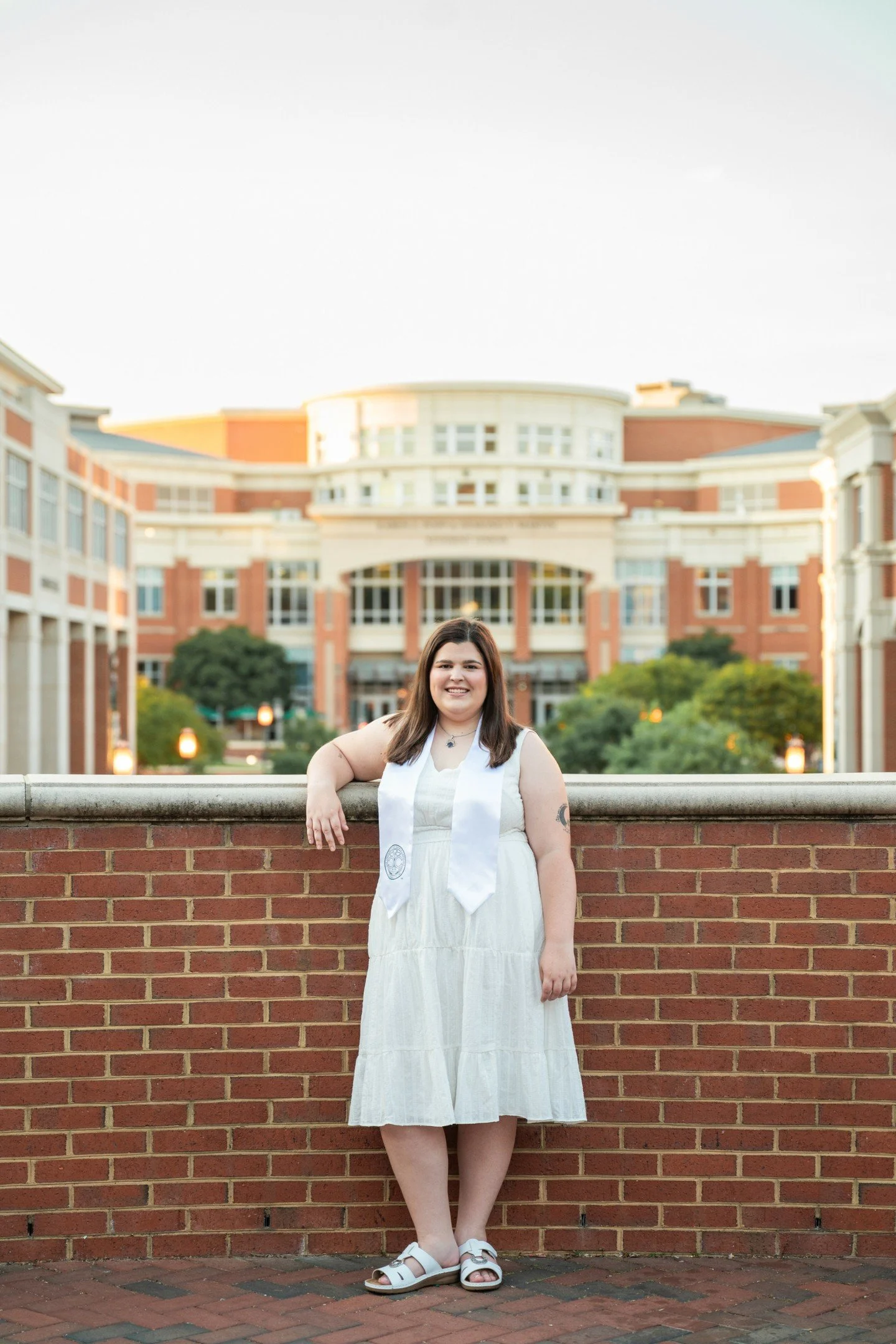 I met Eli for some photos on the campus of UNCC, which I haven't visited in years.  What a beautiful campus!  And what an amazing lady!  We started off in her cap and gown and ended up in the library after we bonded over books.  It was such a fun, pe
