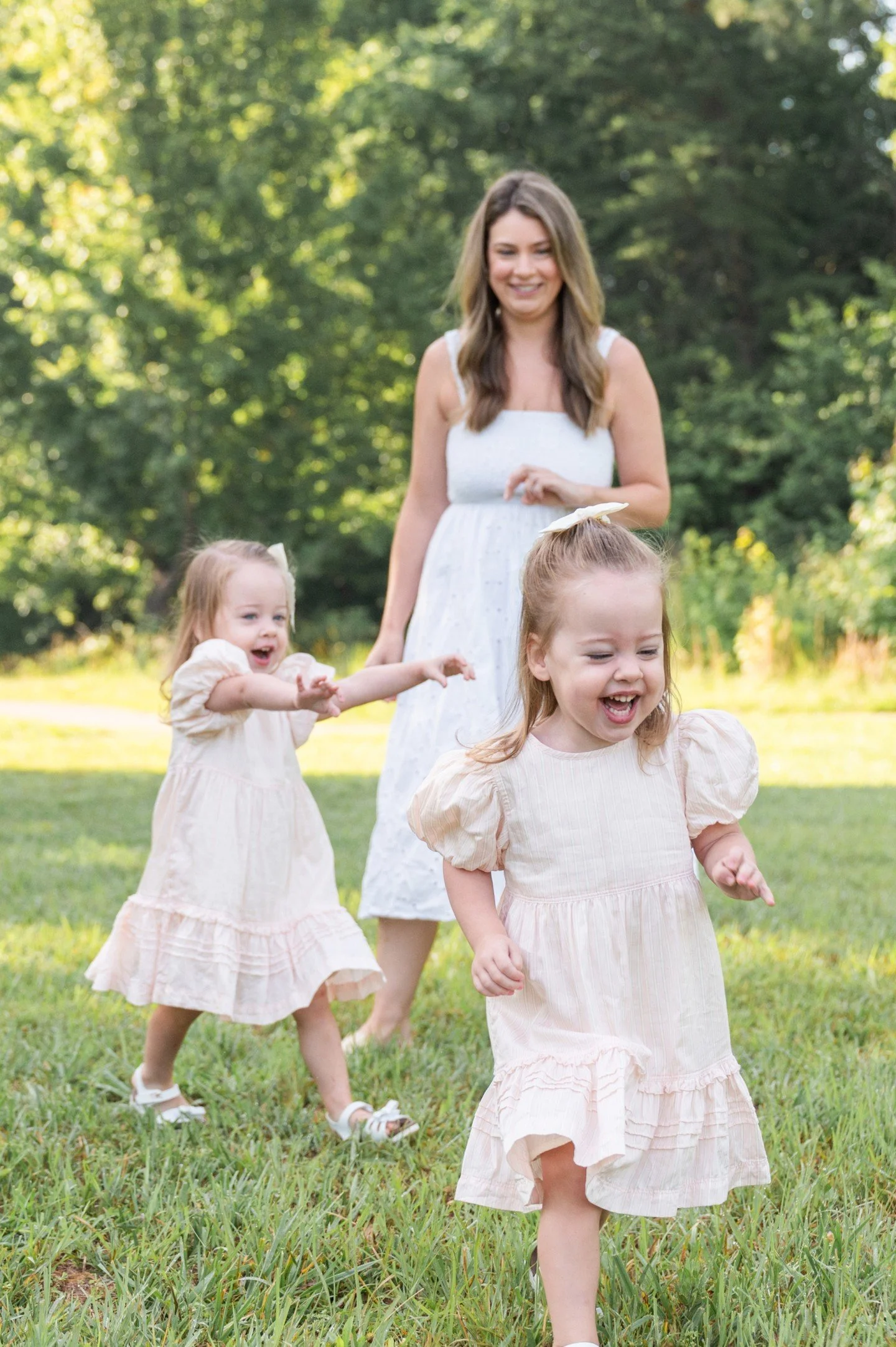 From chasing each other around, singing and dancing to Justin Bieber (can you find the Baby-Baby-Baby-OOOOOO shot?), twirling in dresses, and putting Baby Kitty to bed...photo sessions with the Auch family are always a fun adventure!  These girls hav