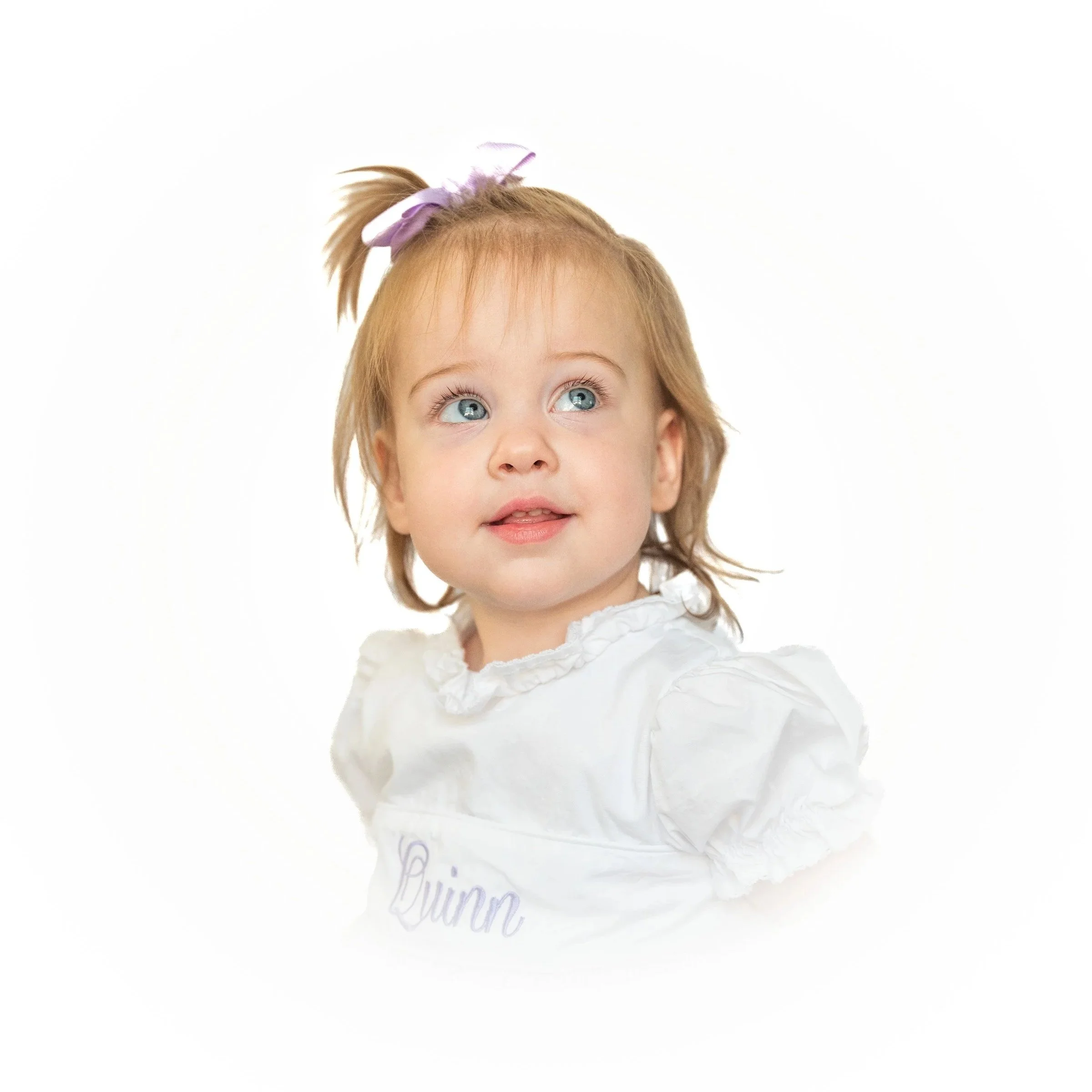 an heirloom photo of an eighteen month old smiling