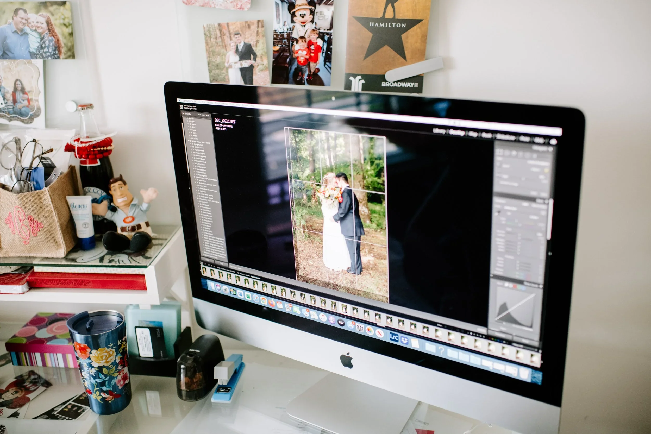 photograph of iMac computer with Lightroom open as a wedding photo is being edited