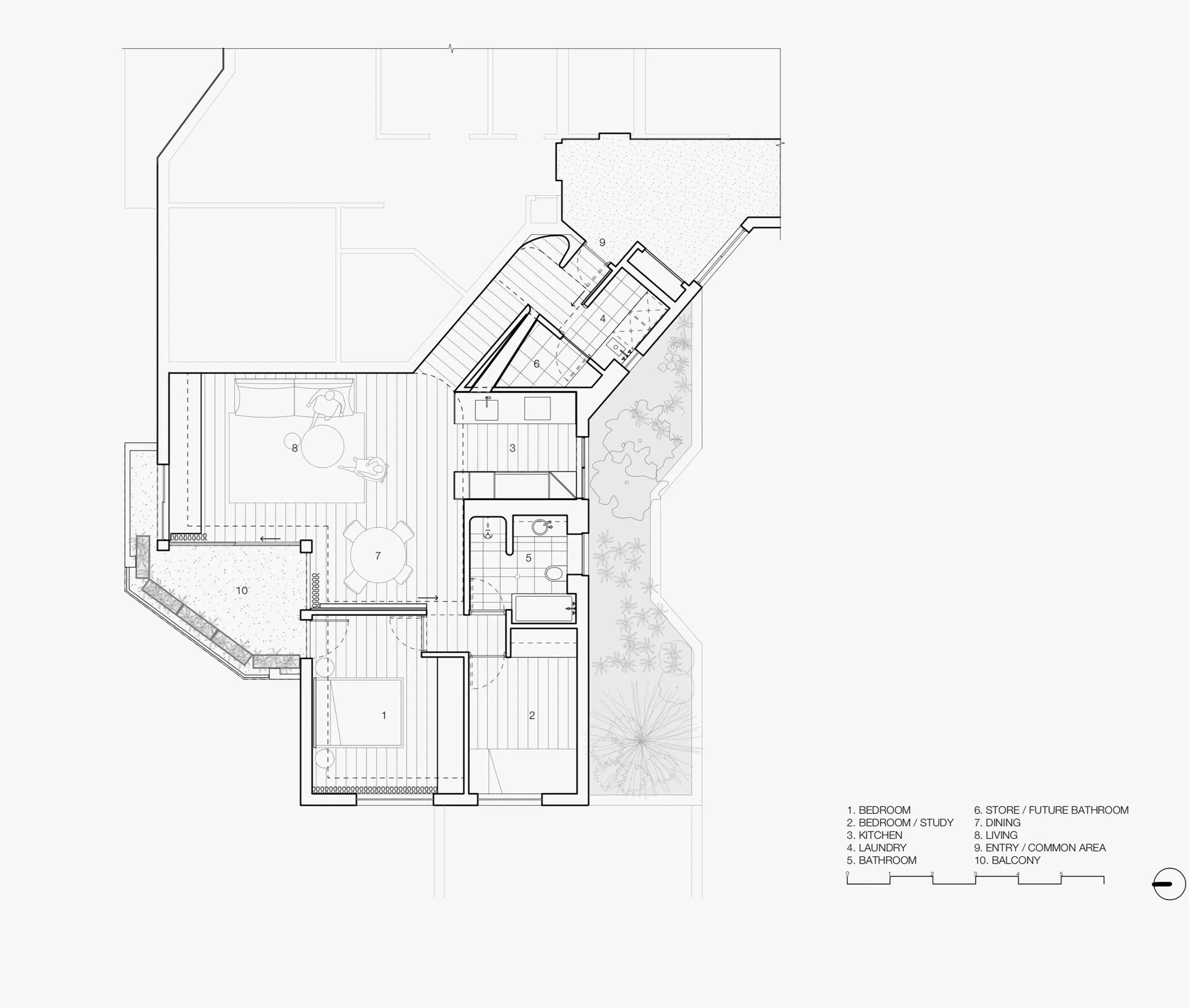 Architectural floor plan showing various rooms labeled with their functions, including bedroom, kitchen, laundry, bathroom, living room, dining area, entry/common area, store/future bathroom, and balcony, with exterior landscaping details.