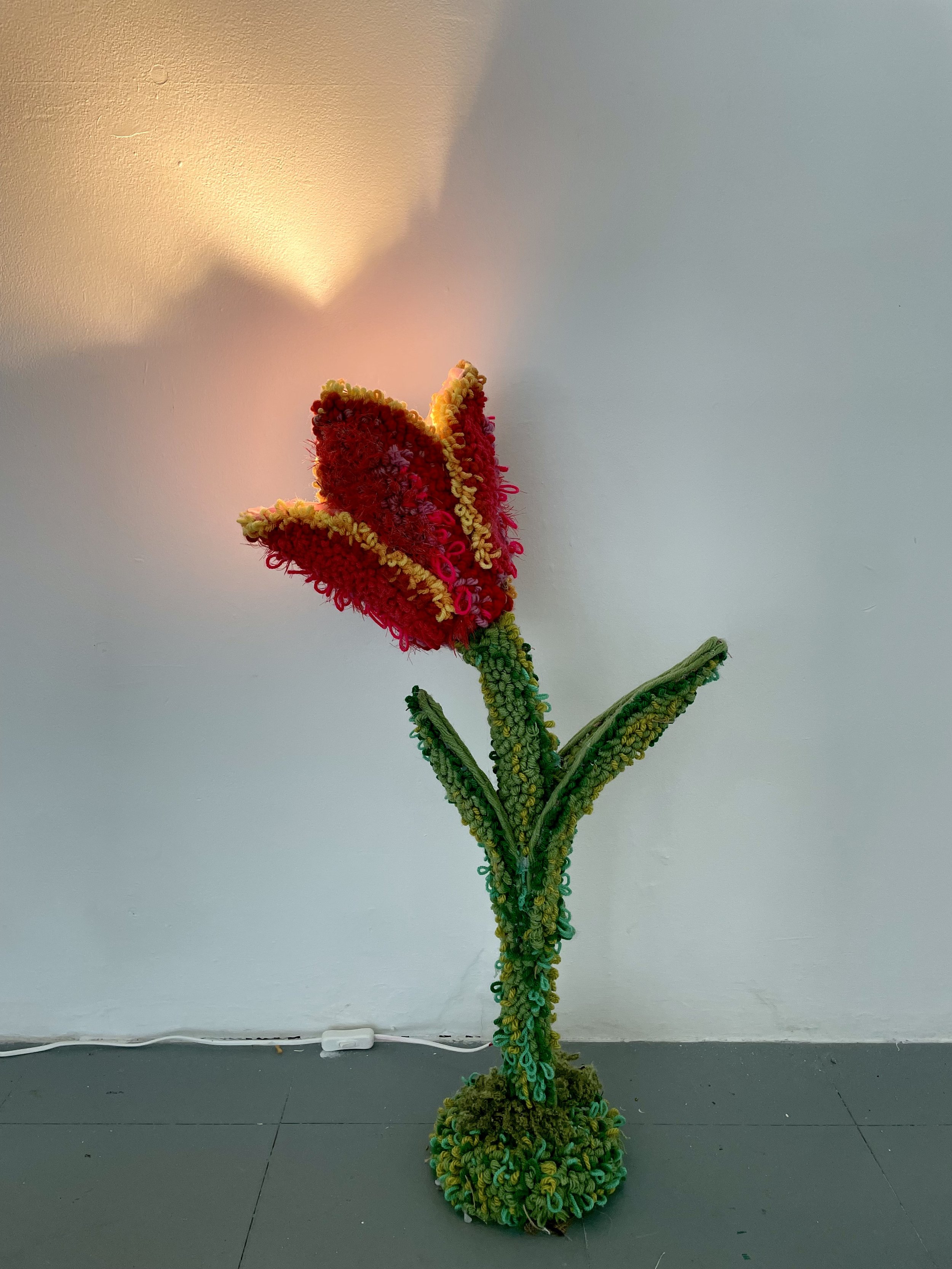 A glimpse of a orange glow in the blue dawn light, 2022, 75x30cm, wool, tinsel, wire, hessian and metal lamp 