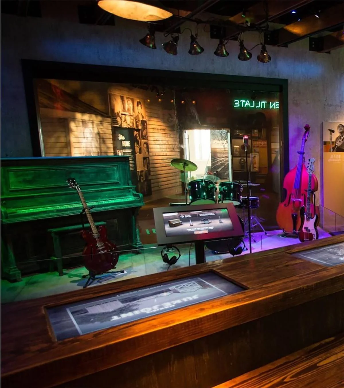 The Juke Joint is an interactive space resembling a Juke Joint with a bar area where the countertop interactive is located, and a staging area displaying the stage interactive.