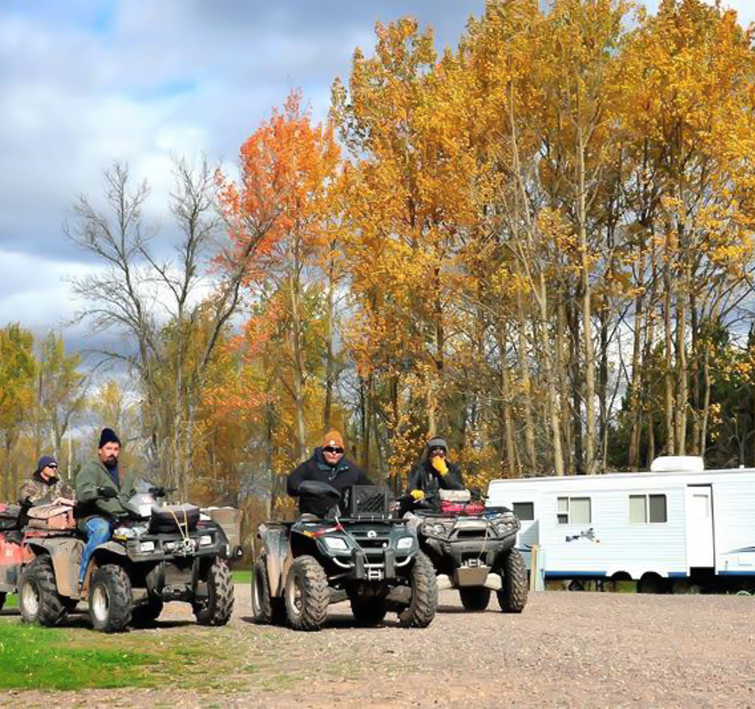 ATV riders in campground.png