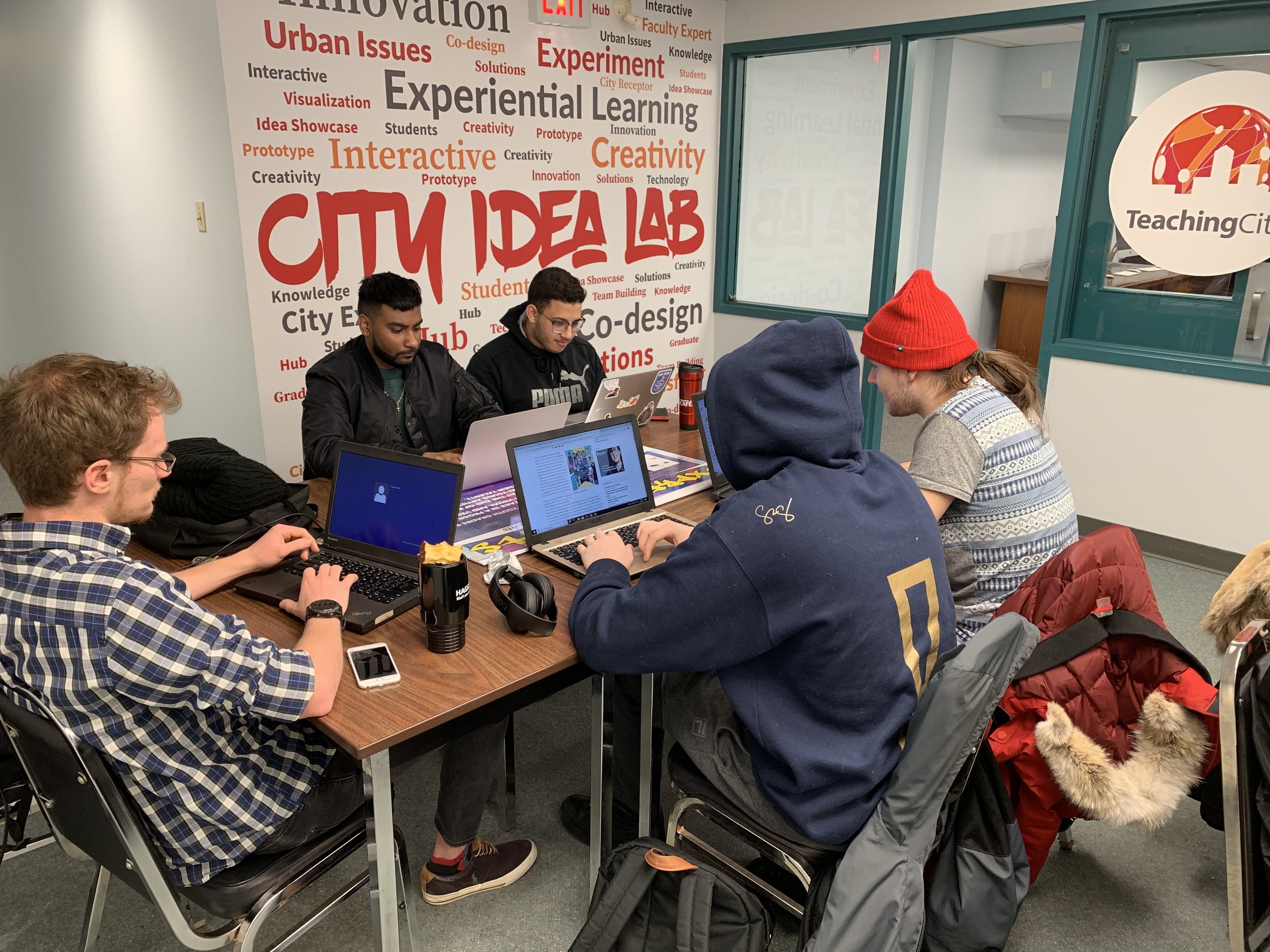 Students working together at the Teaching City Hub