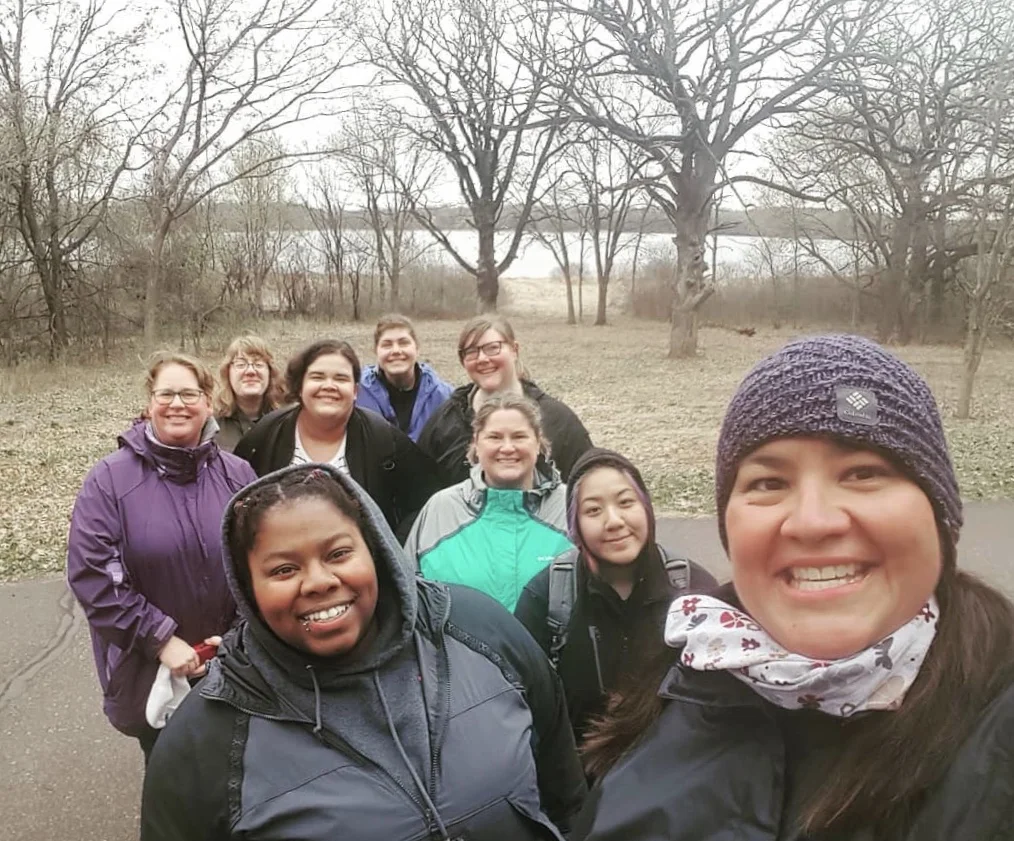 Image description: group of hikers taking a selfie.