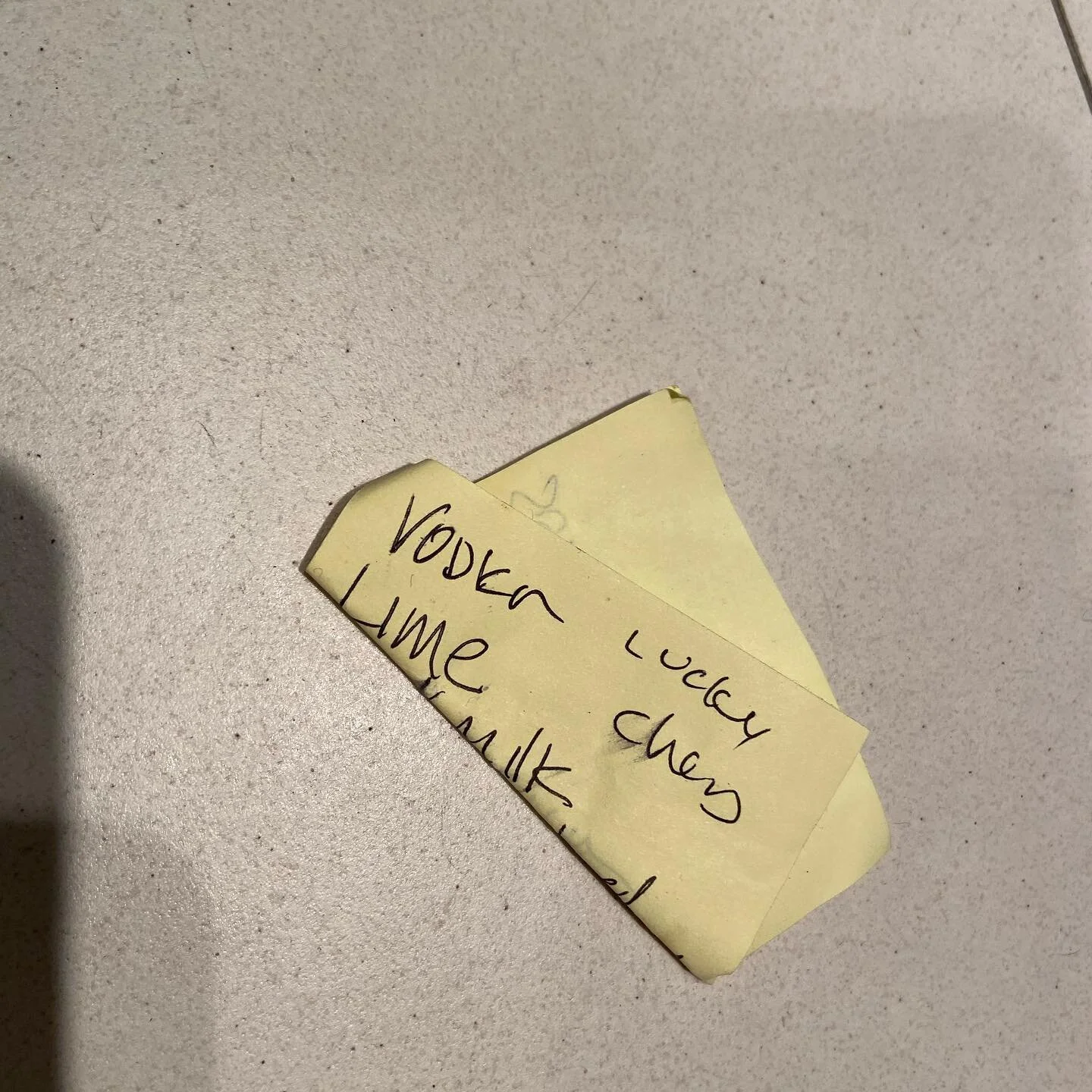 Found on floor.
Vodka
Lime 
Lucky Charms

Makes complete sense.