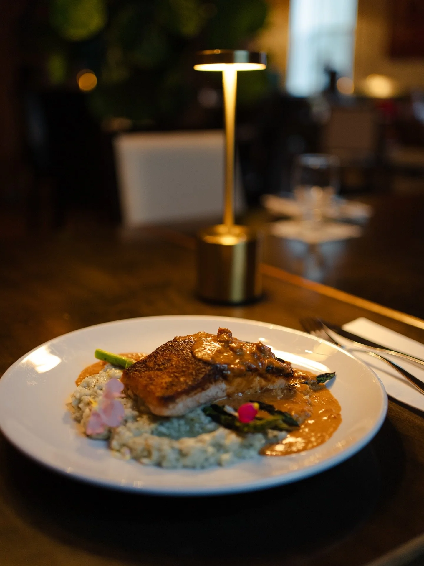 Blackened. Bold. Unforgettable. 🔥🐟
Cajun-crusted Atlantic salmon with basil pesto risotto and sundried tomato cream.

#TheGypsyTeaRoom #BlackenedSalmon #StJohnsEats #SeafoodLovers