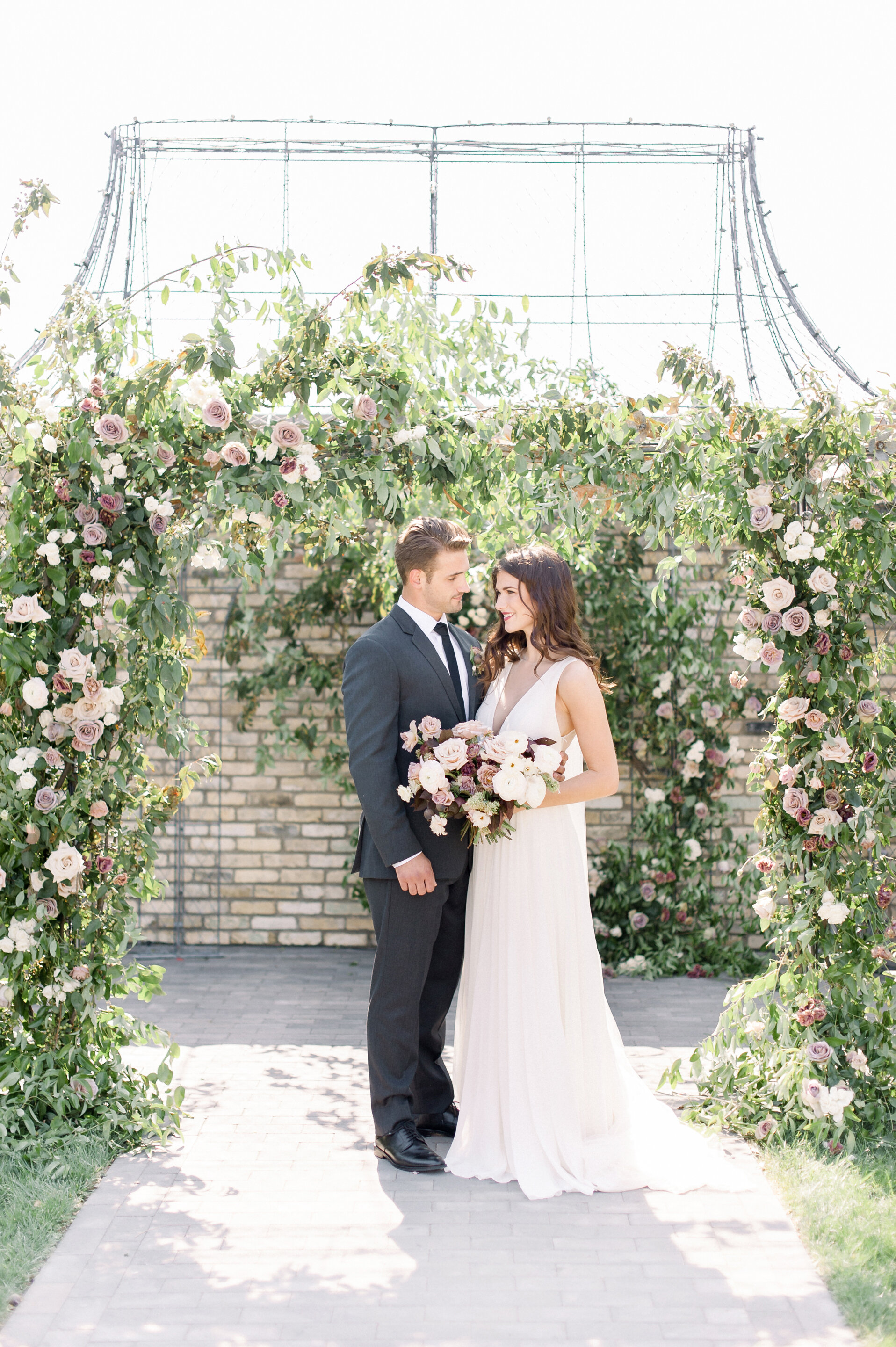  Photography by: Maria Mack  Gown: BHLDN  Groom’s Attire: The Black Tux  Jewelry: L. Priori  Glam: Hayley Annino  Design: Arielle Fera Events  Florals: Twisted Willow Flowers  Rentals: White Glove Rentals   