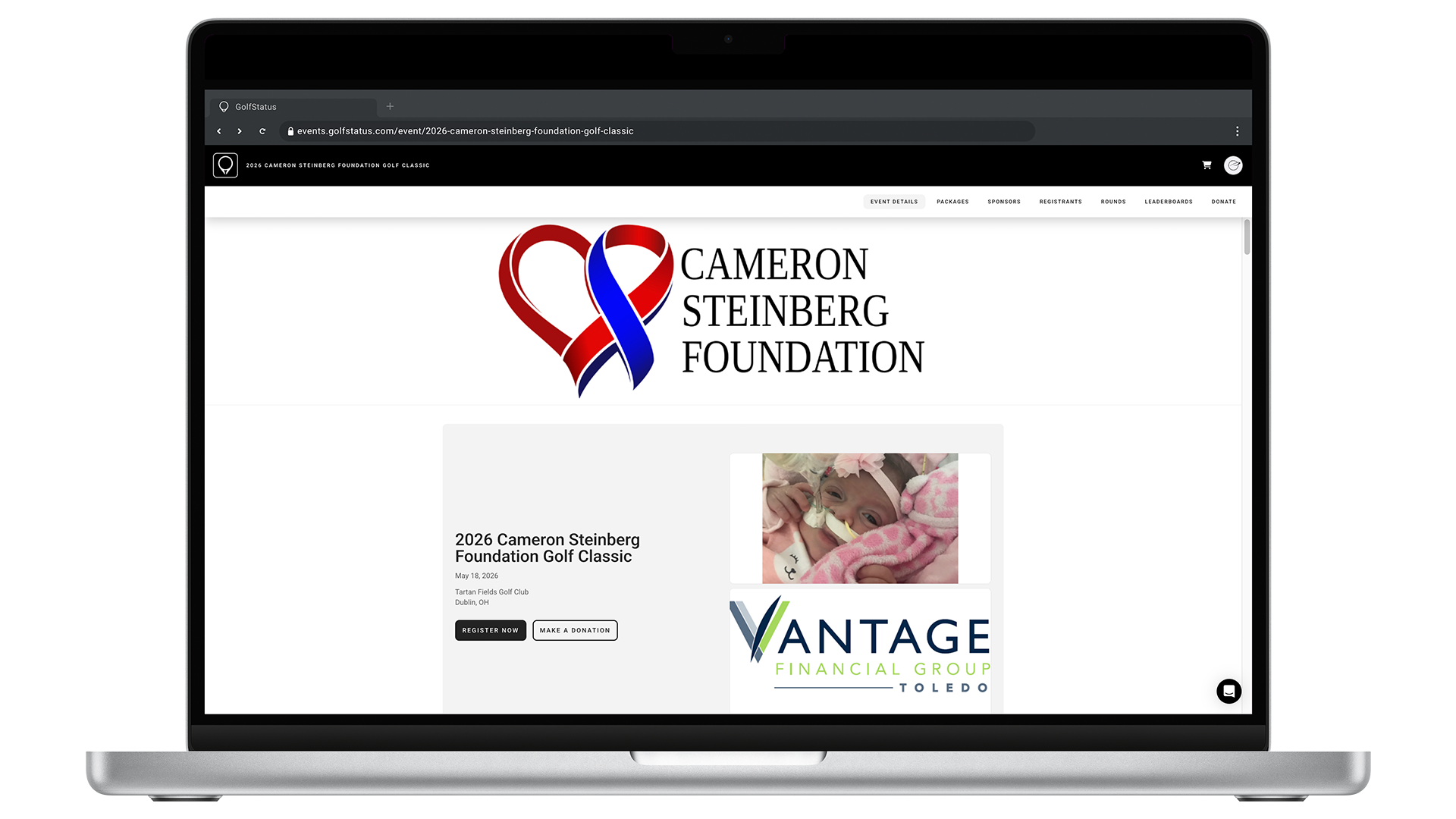 The homepage of a golf tournament website is displayed on a laptop computer.