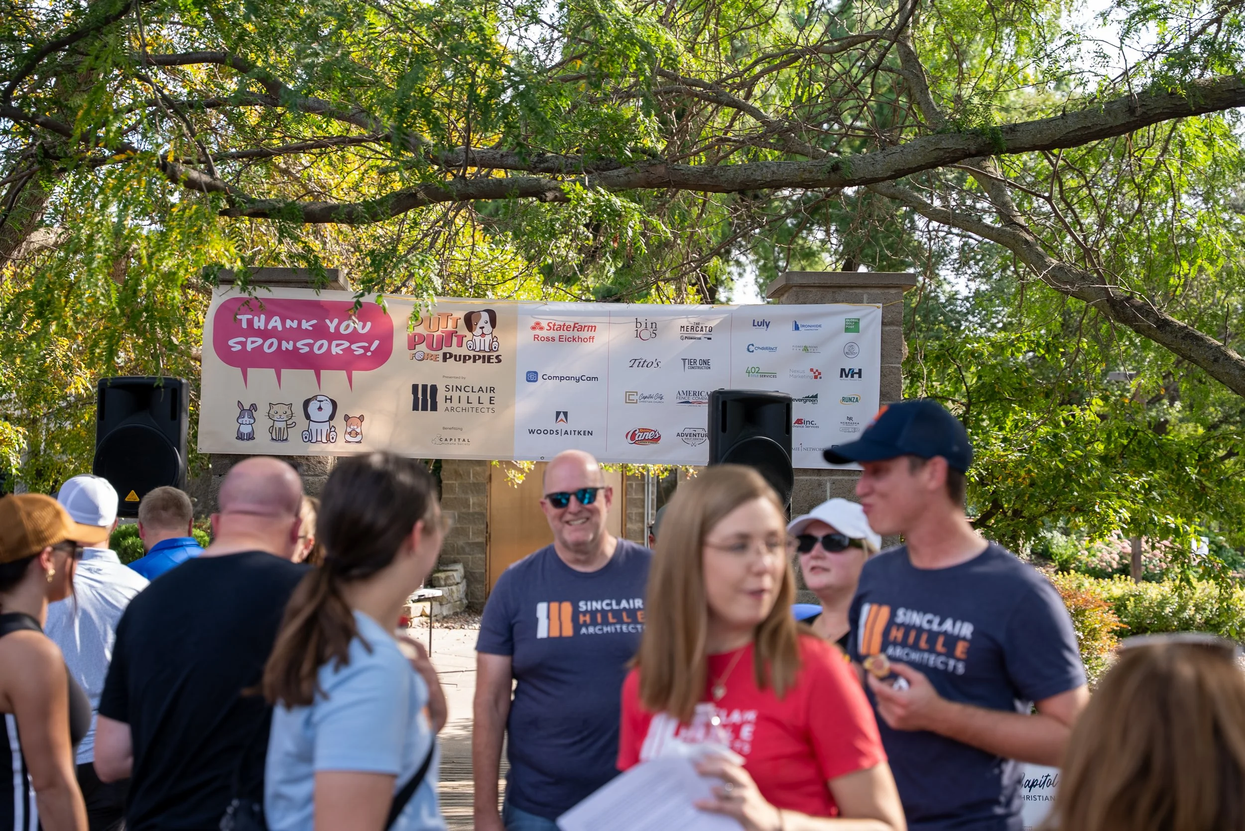 Golfers mingle and network before the start of a golf fundraiser.