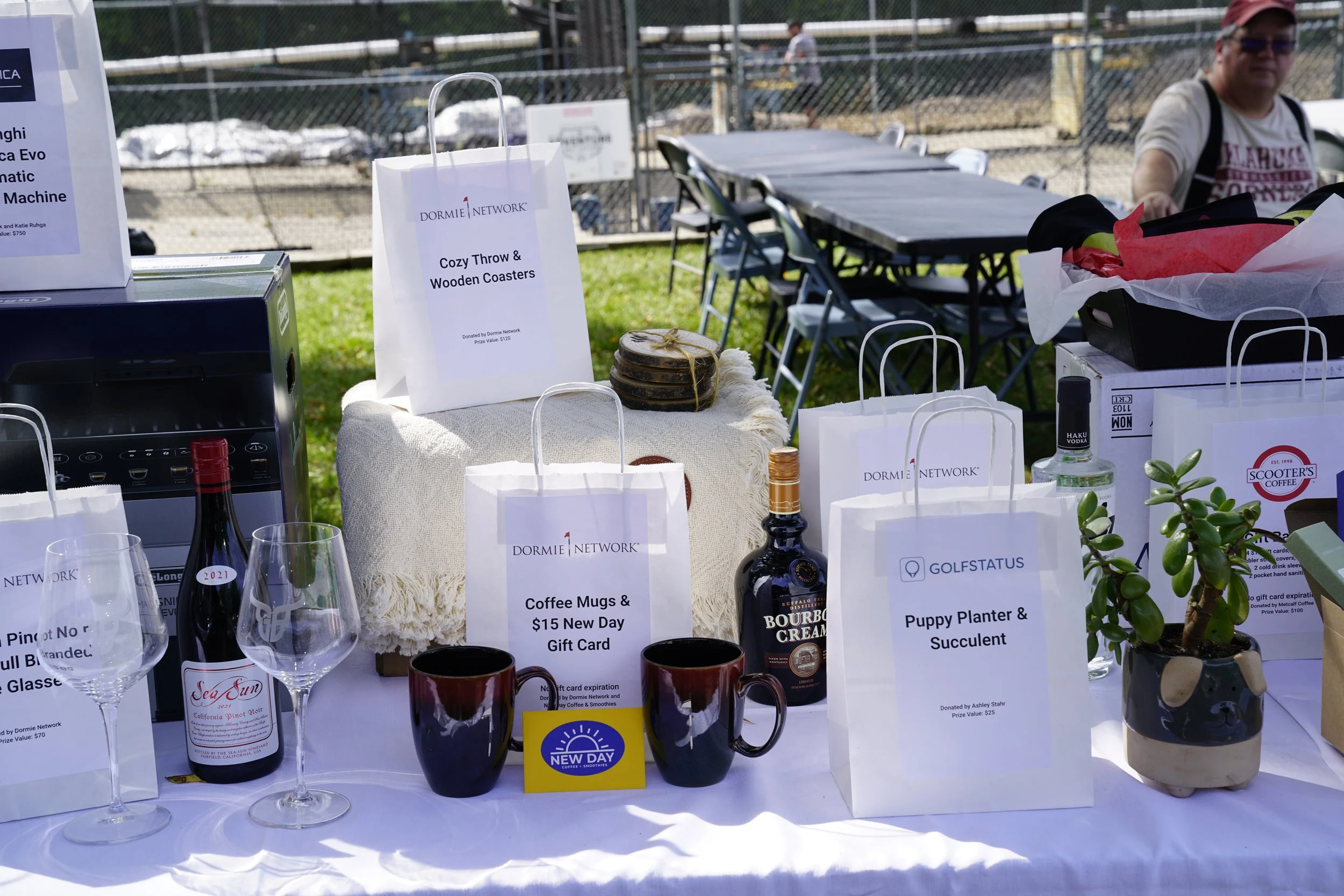 In-kind donations used as raffle prizes are displayed at a charity golf tournament.
