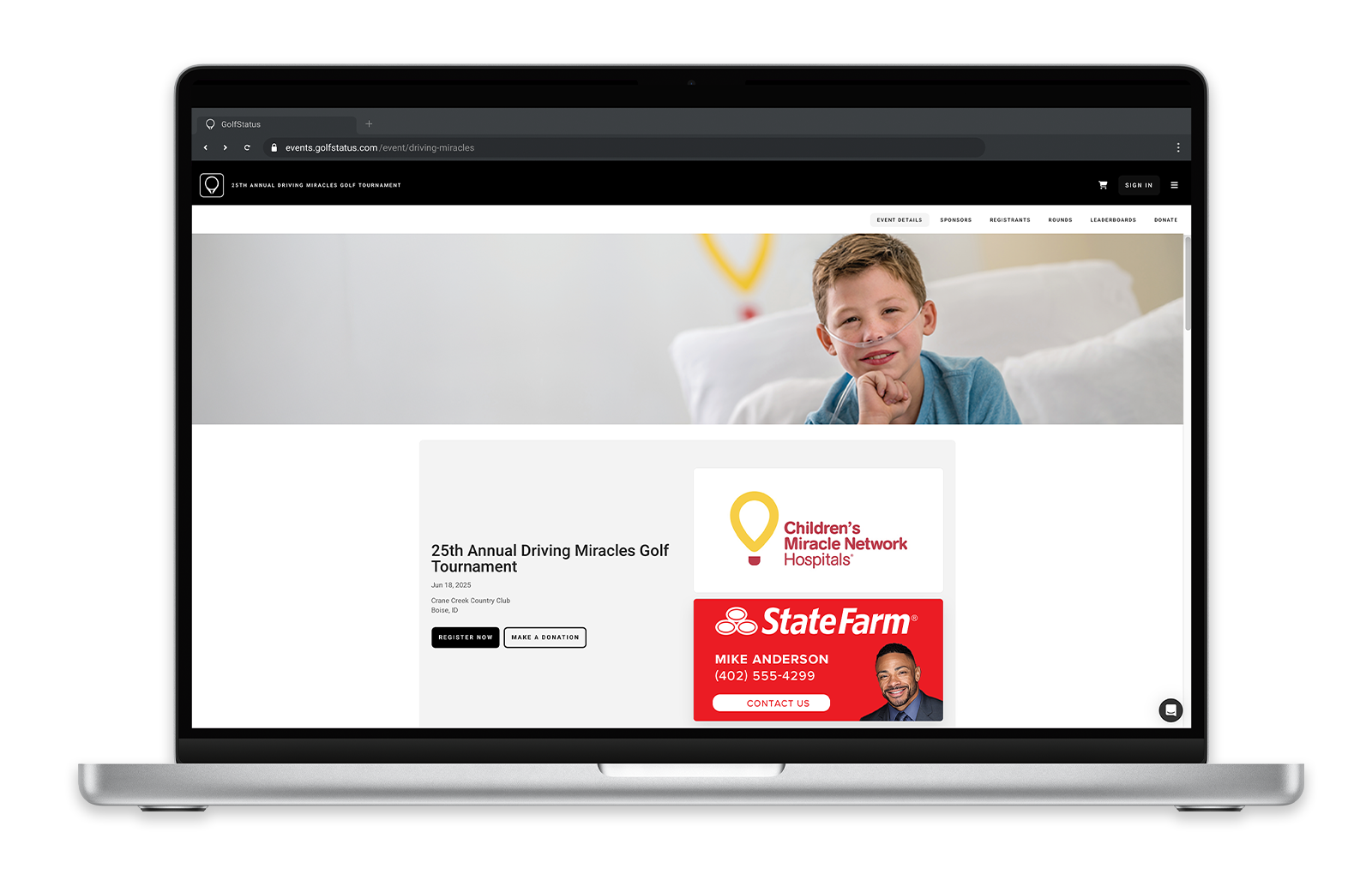 The homepage of a golf tournament website is shown on a laptop computer.