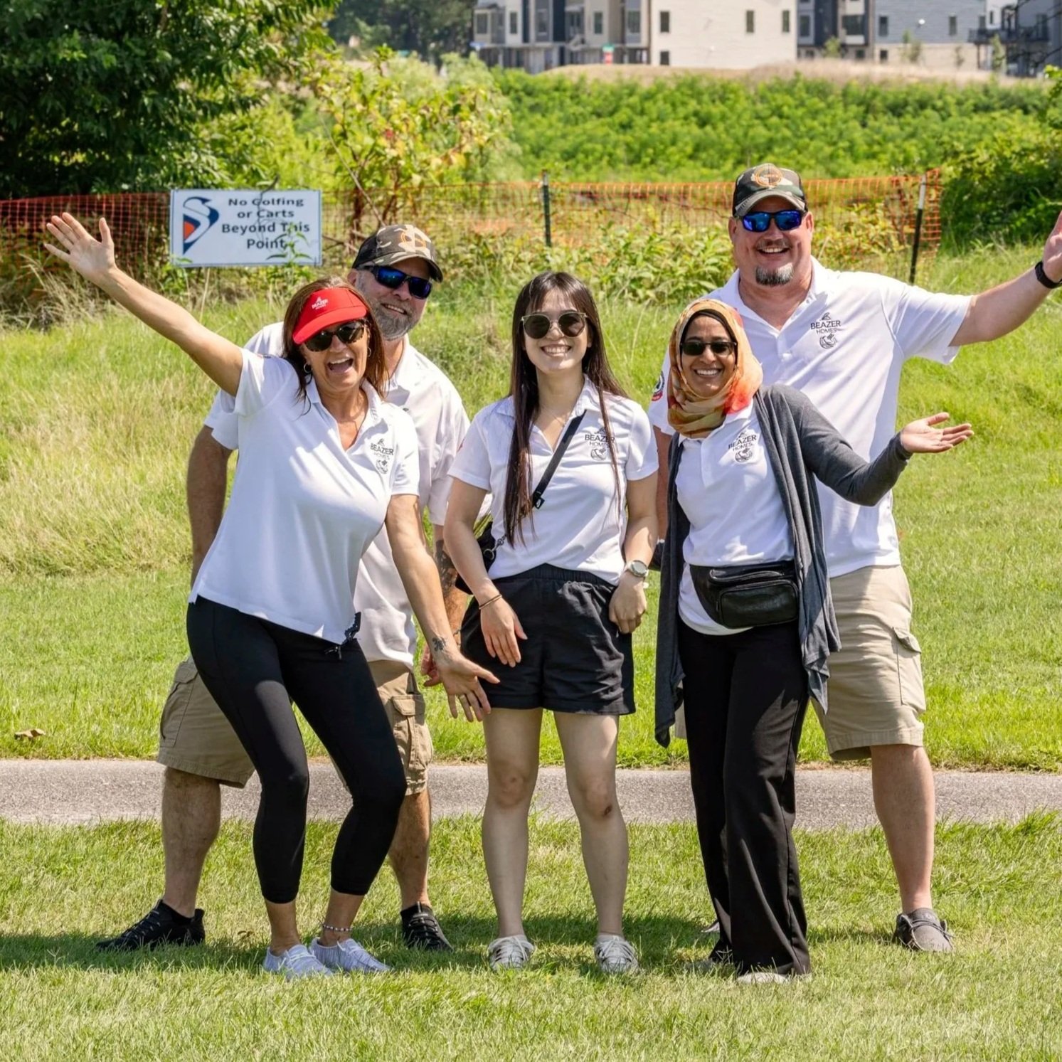 Five Beazer Homes employees pose at a charity golf tournament.