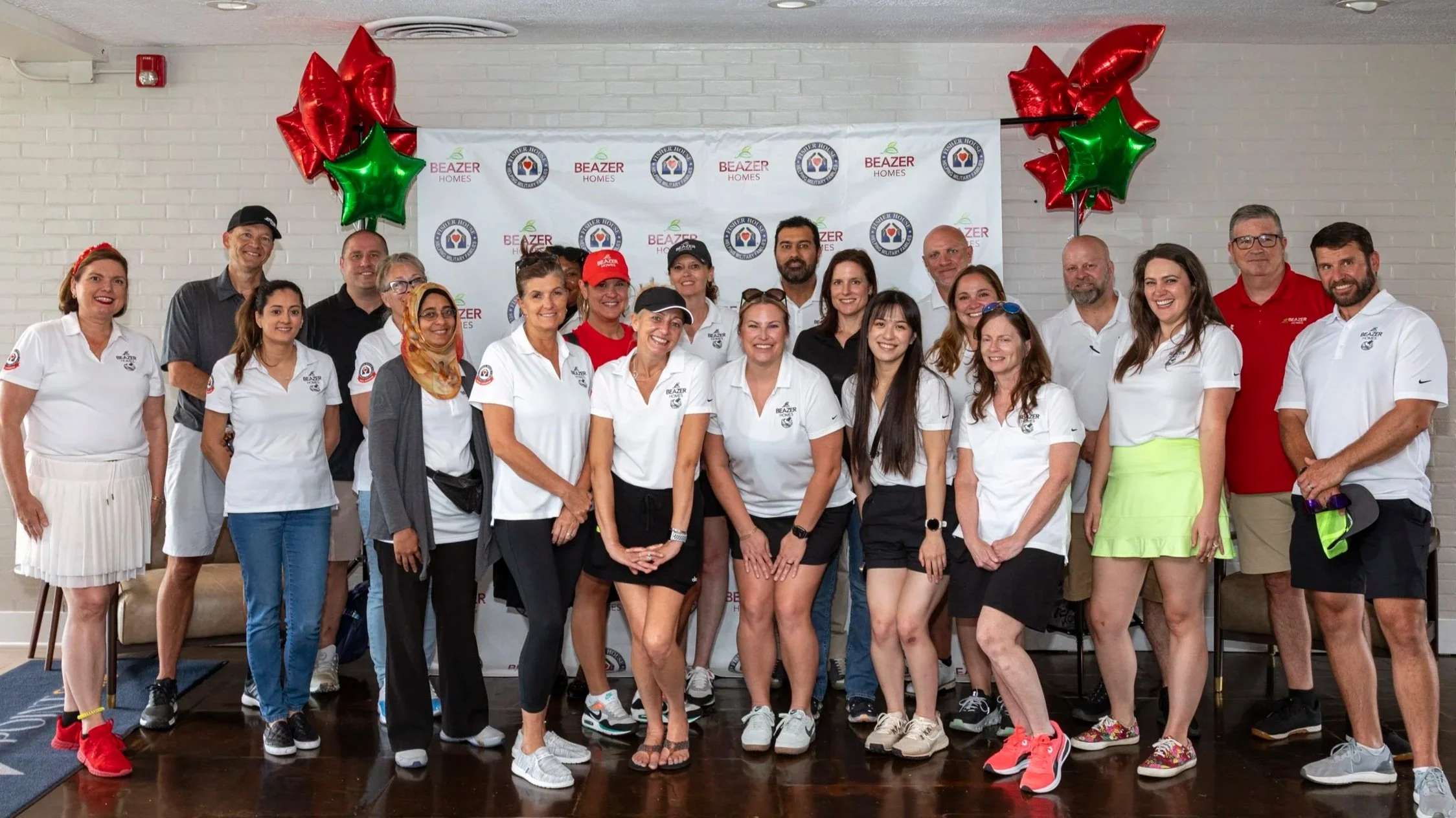 Beazer Homes employees pose for a photo at their charity golf tournament.