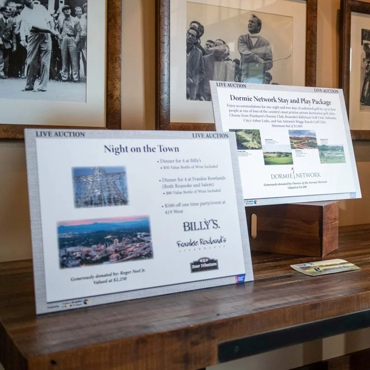 Two signs promoting in-kind donations used in a golf tournament raffle.