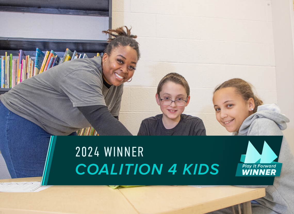 Two kids and a teacher at an after-school program.