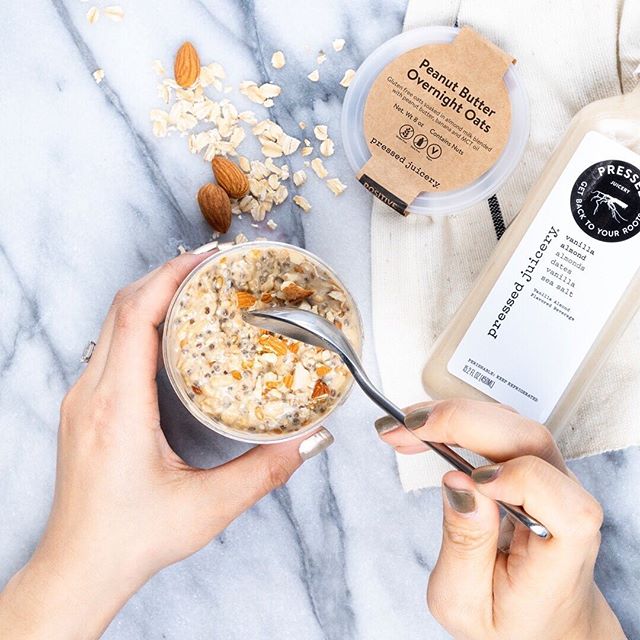 Have you tried the new Peanut Butter Overnight Oats at Pressed?! Made with gluten-free oats soaked in almond milk blended with peanut butter, banana, and MCT oil. | 📷: @pressedjuicery