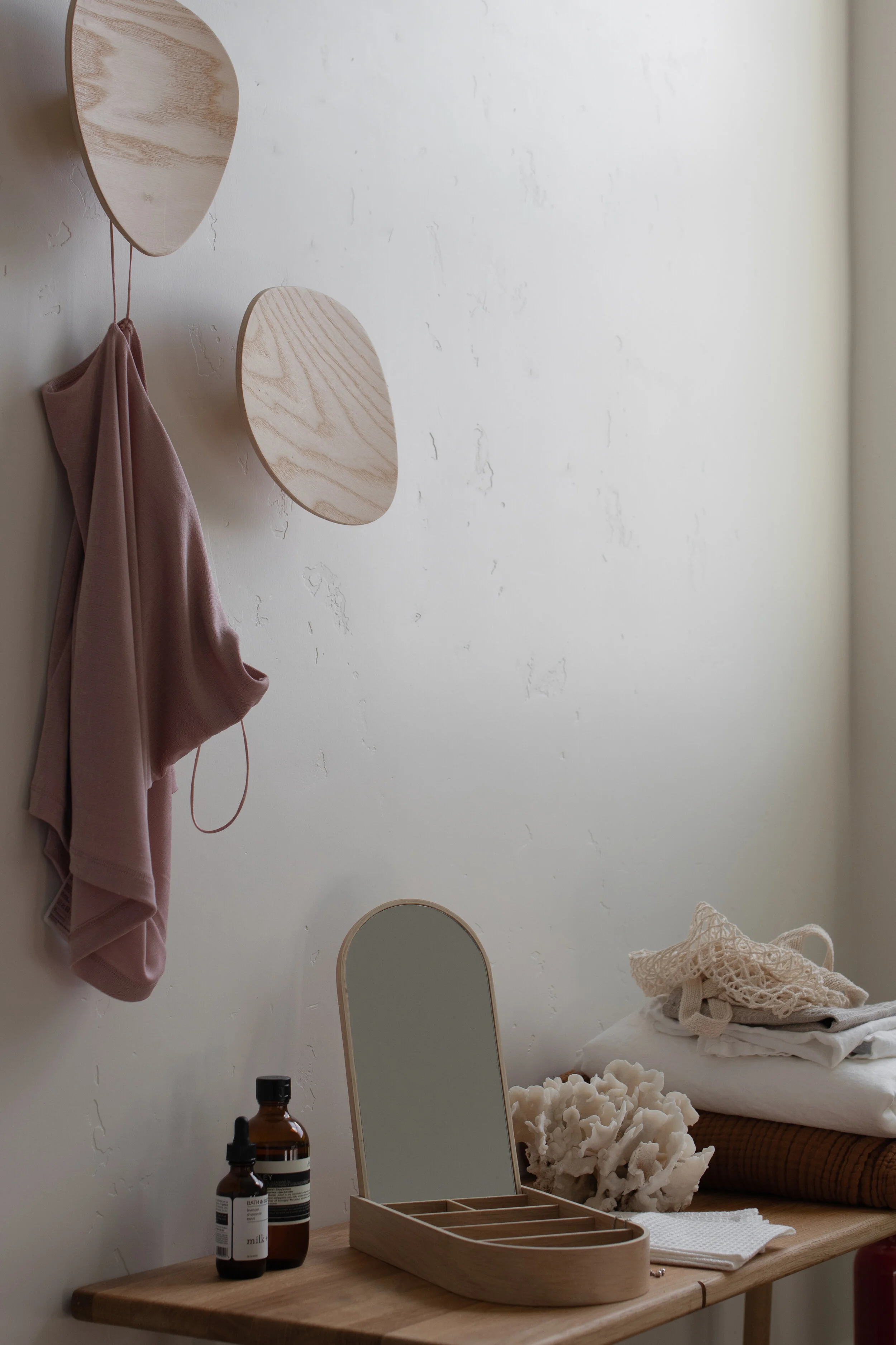 Closet area with light oak wall hooks