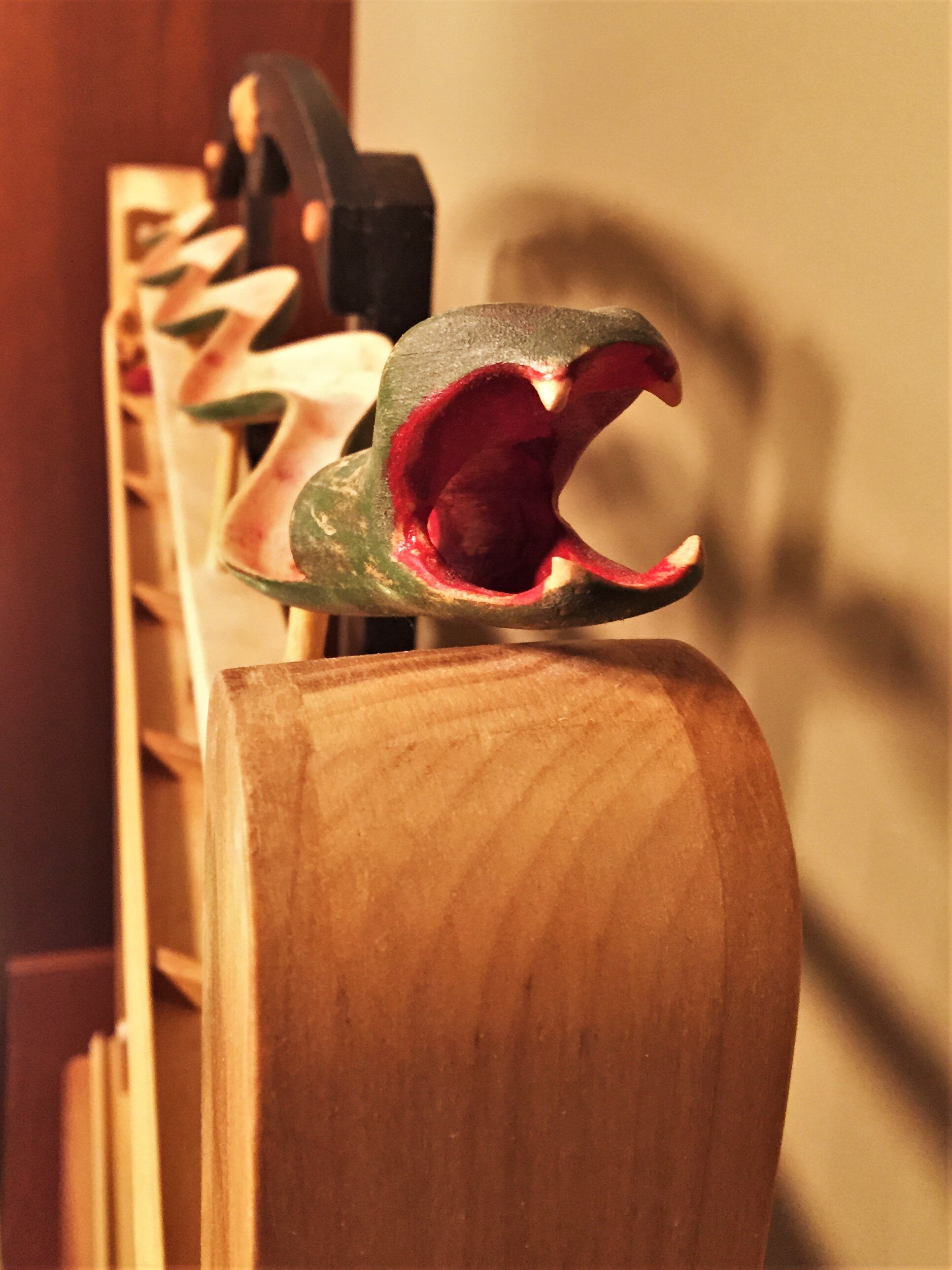  Along with the following pics, this shows an element of an elaborate rolling ball sculpture, reminiscent of Rube Goldberg machines.  Drop a marble into the snake’s mouth and it begins a circuitous journey to the bottom along one of four possible tra