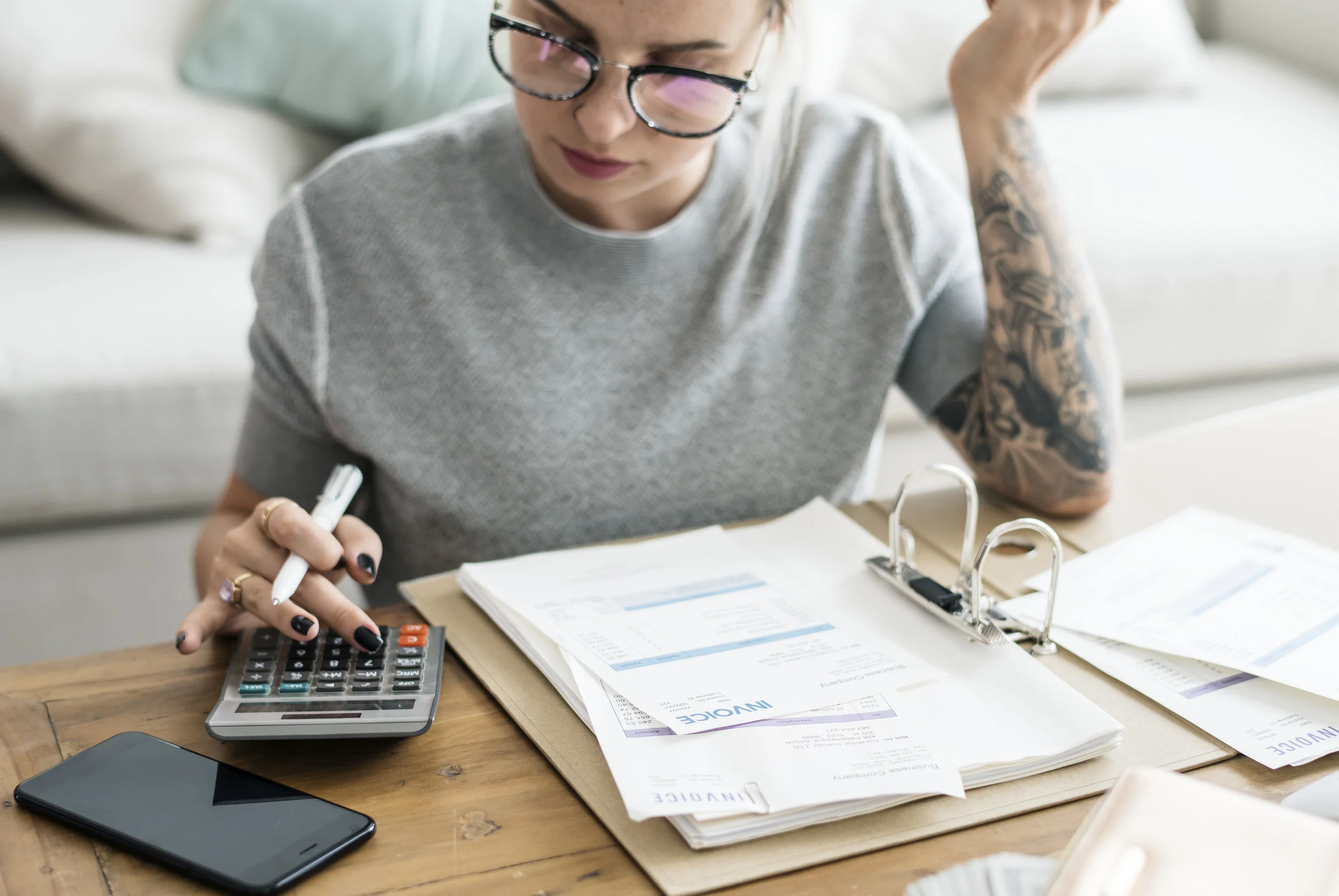 caucasian-woman-with-invoice-bills-PW6PDBS.jpg