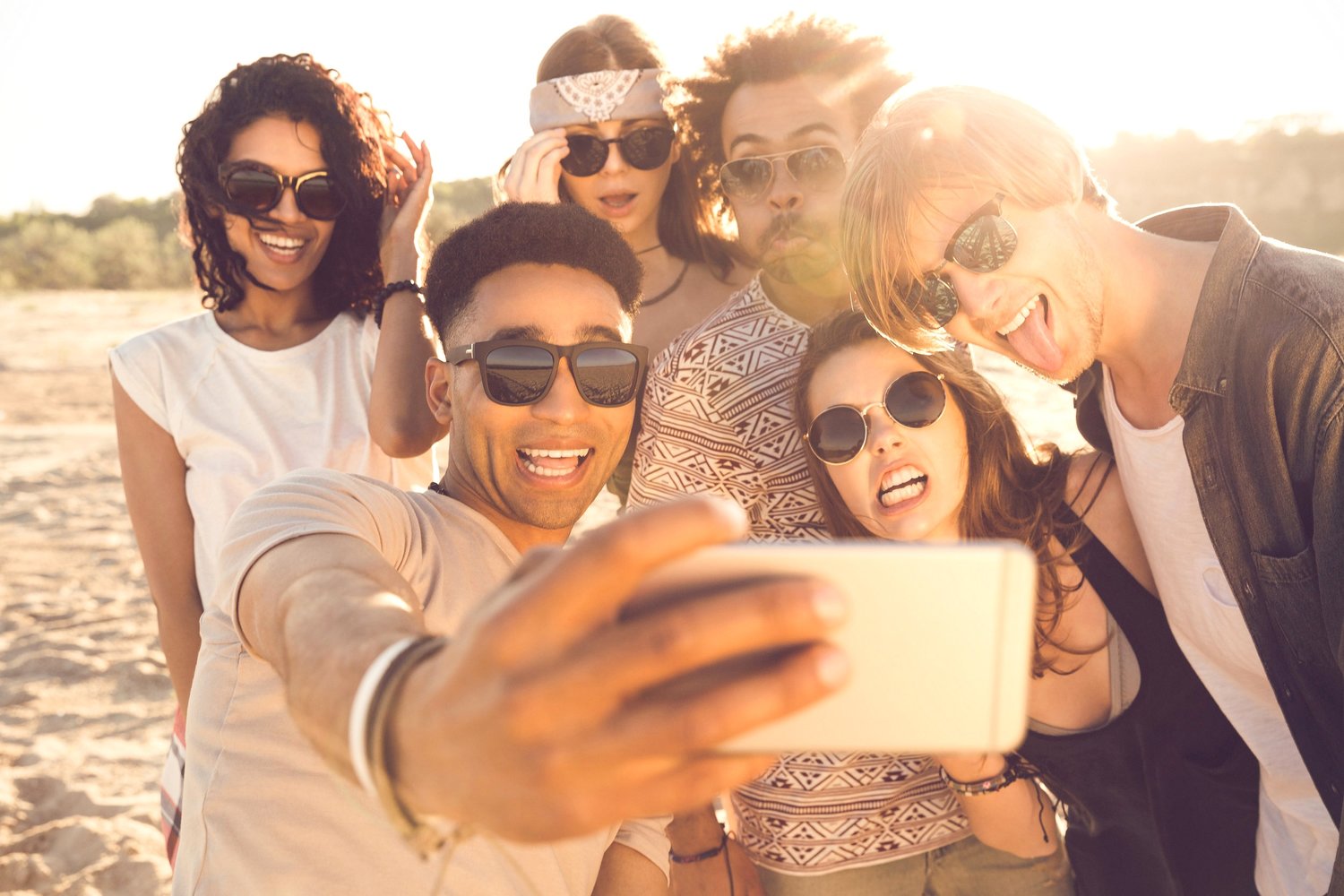 multiracial-group-of-friends-taking-selfie-PCYJRGQ.jpg