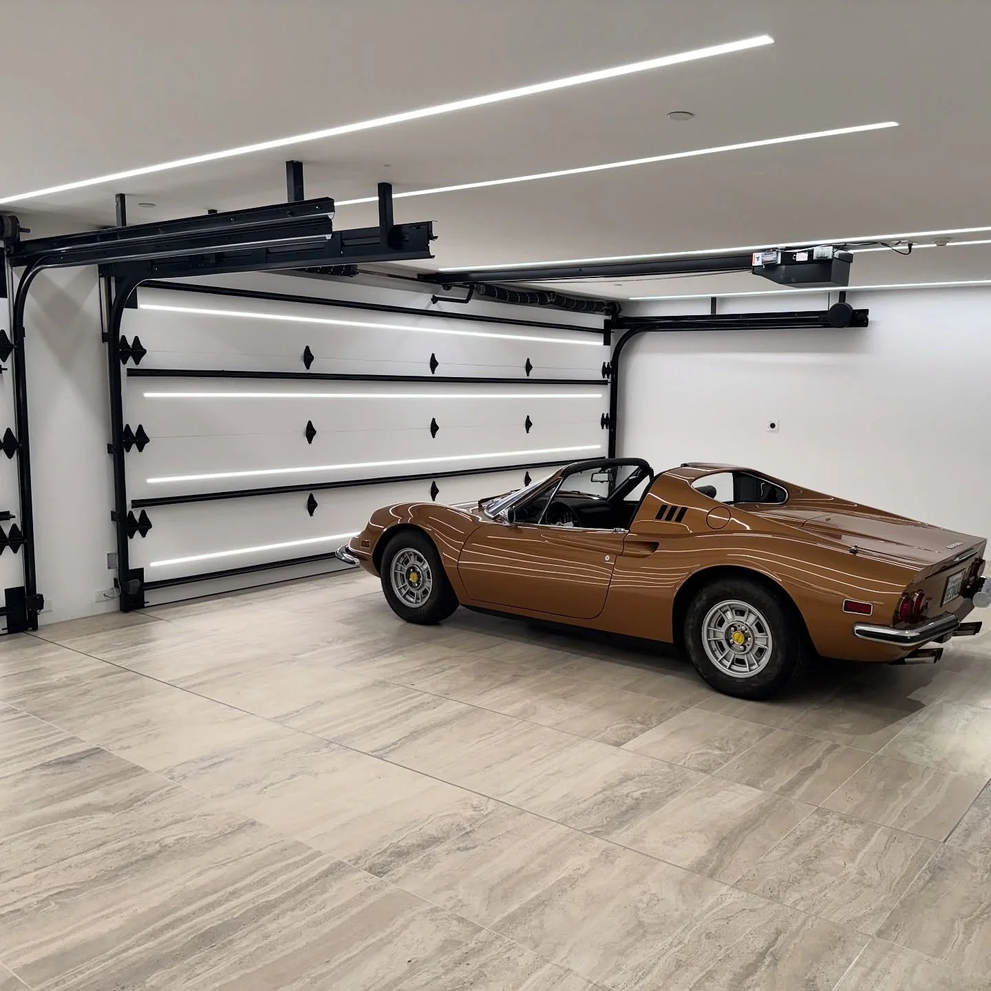 When the garage is designed to display!  #9259robindrive #246gts #hollywoodhills #interiordesign #architecture #dwell #luxurylifestyle #luxuryhomes @ig_interiors