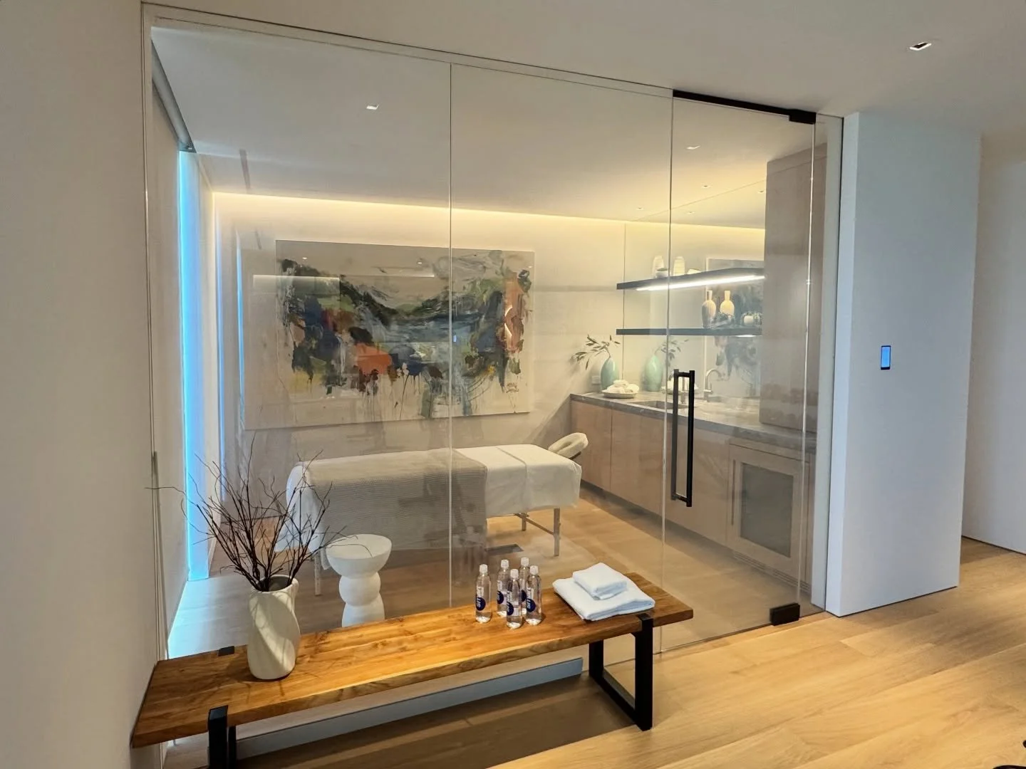 Sneak peak of the massage room with switched privacy glass.