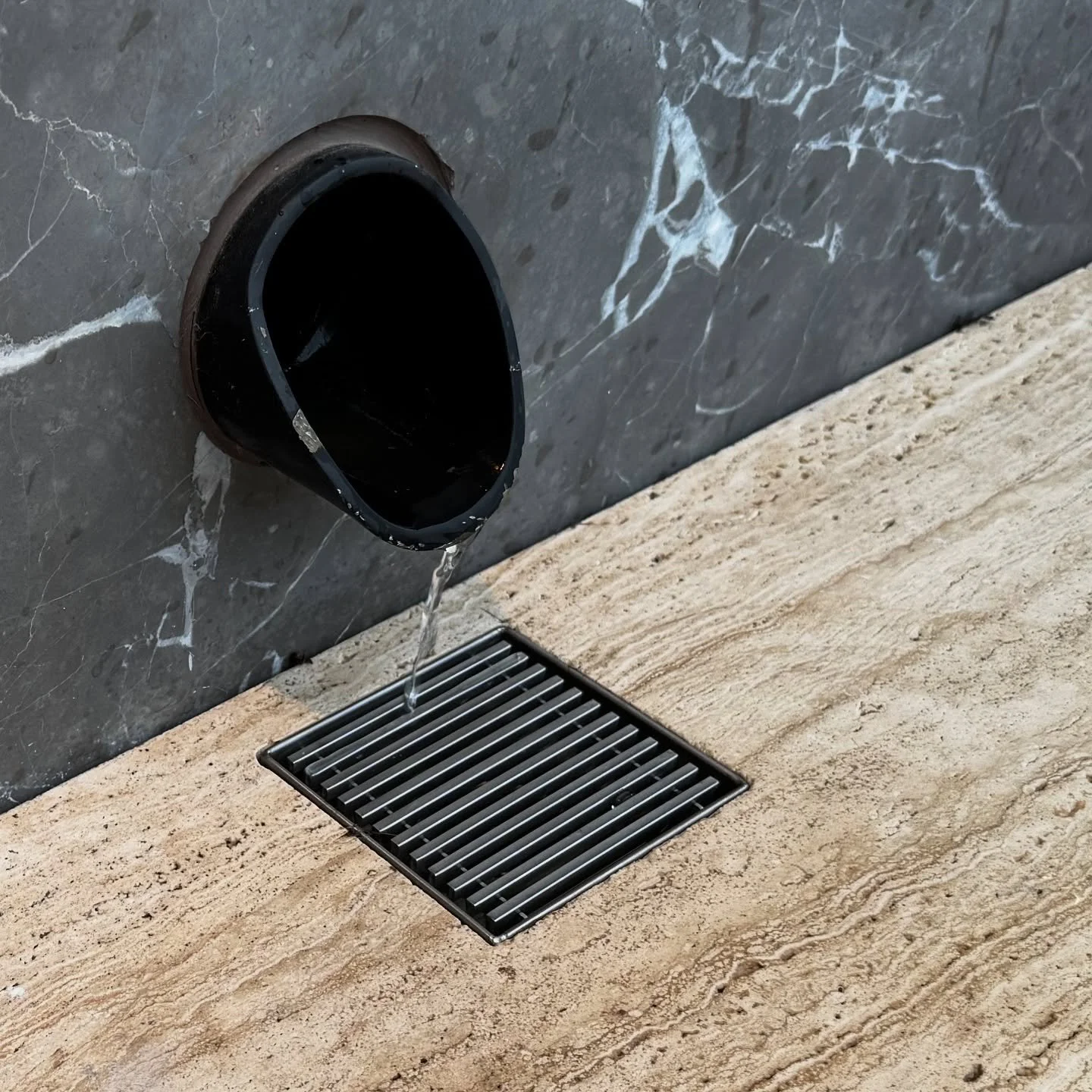 Our design which incorporates this little inlayed flush drain detail to keep your decks dry as the morning dew runs off.
