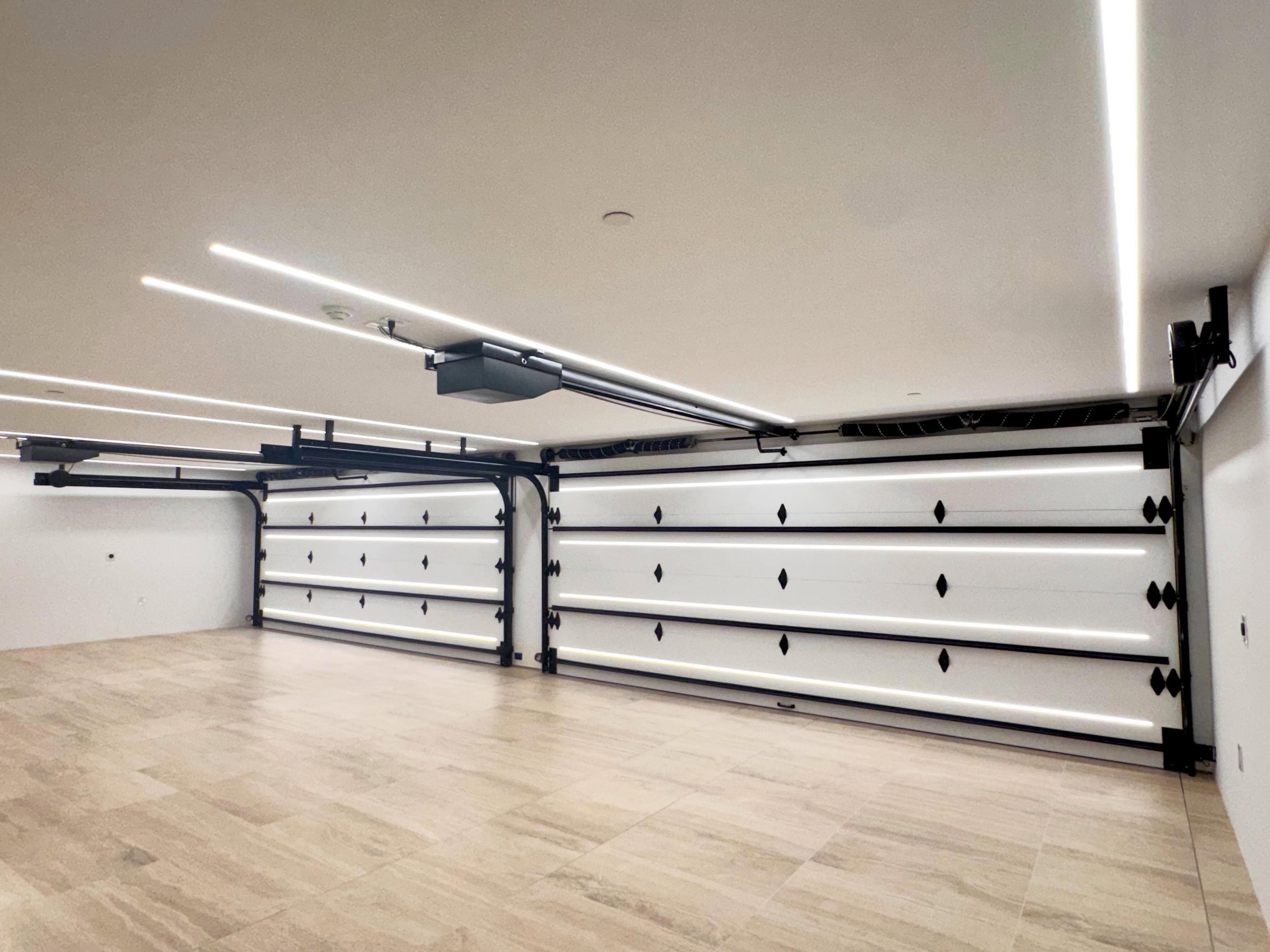 Our high level of detail and refinement doesn&rsquo;t stop at interiors- our garages match.  #customgaragedoors #dreamgarage #hollywoodhills #customhomes #luxuryhomes
