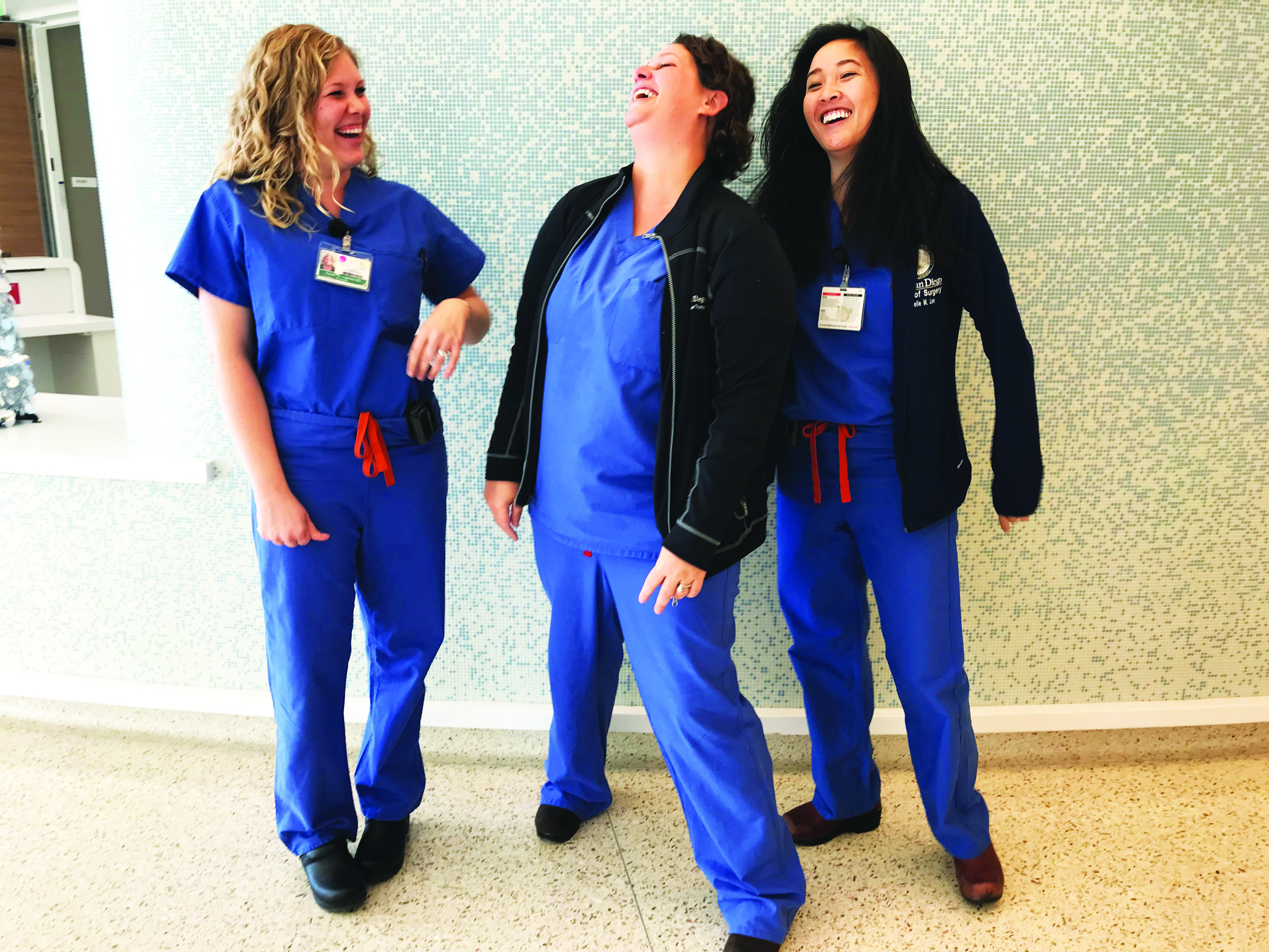 Kimmy Gross, Nurse Practitioner, Transplant, center; Sarah Stringfield, MD, left, and Arielle Lee, MD, right, both general surgery residents