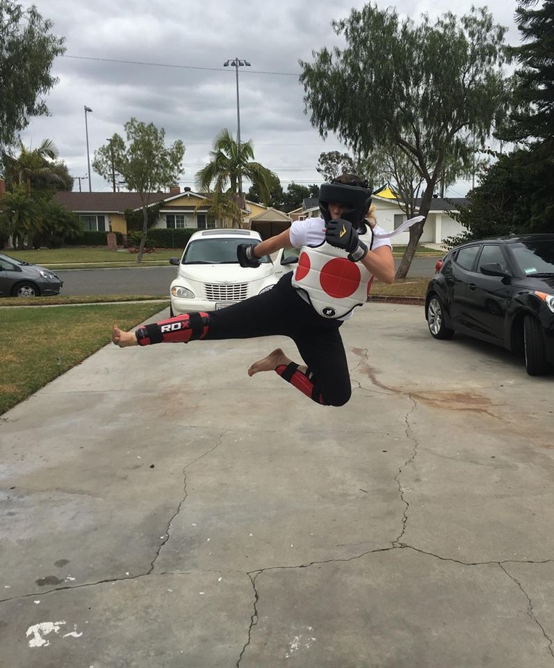 Top student Stephanie Shelton demonstrates jumping roundhouse after sparring