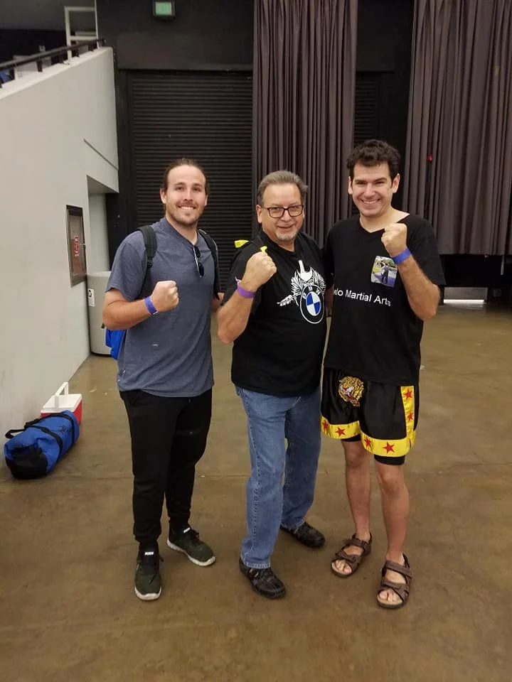 Everyone was very supportive of my first fight. On the left Tim, my Dad, and myself. At the IKF Muay Thai Tournament.