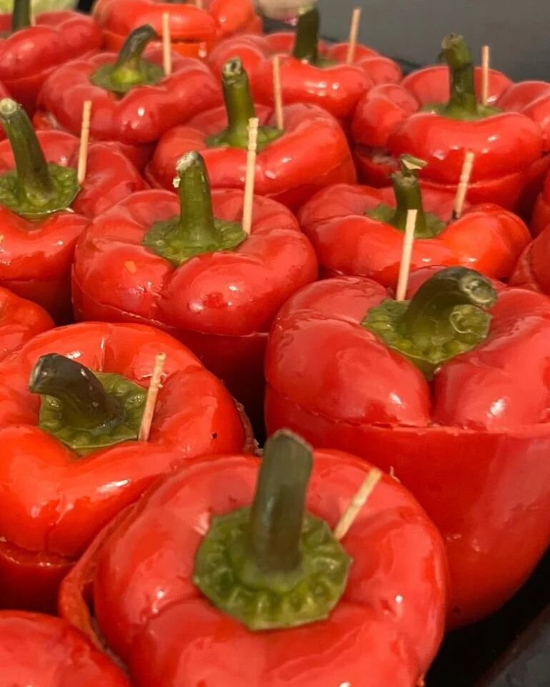 A quick peek into the kitchen- Glossy red, stuffed peppers ready for the oven, beautiful, nutritious and delicious too!
