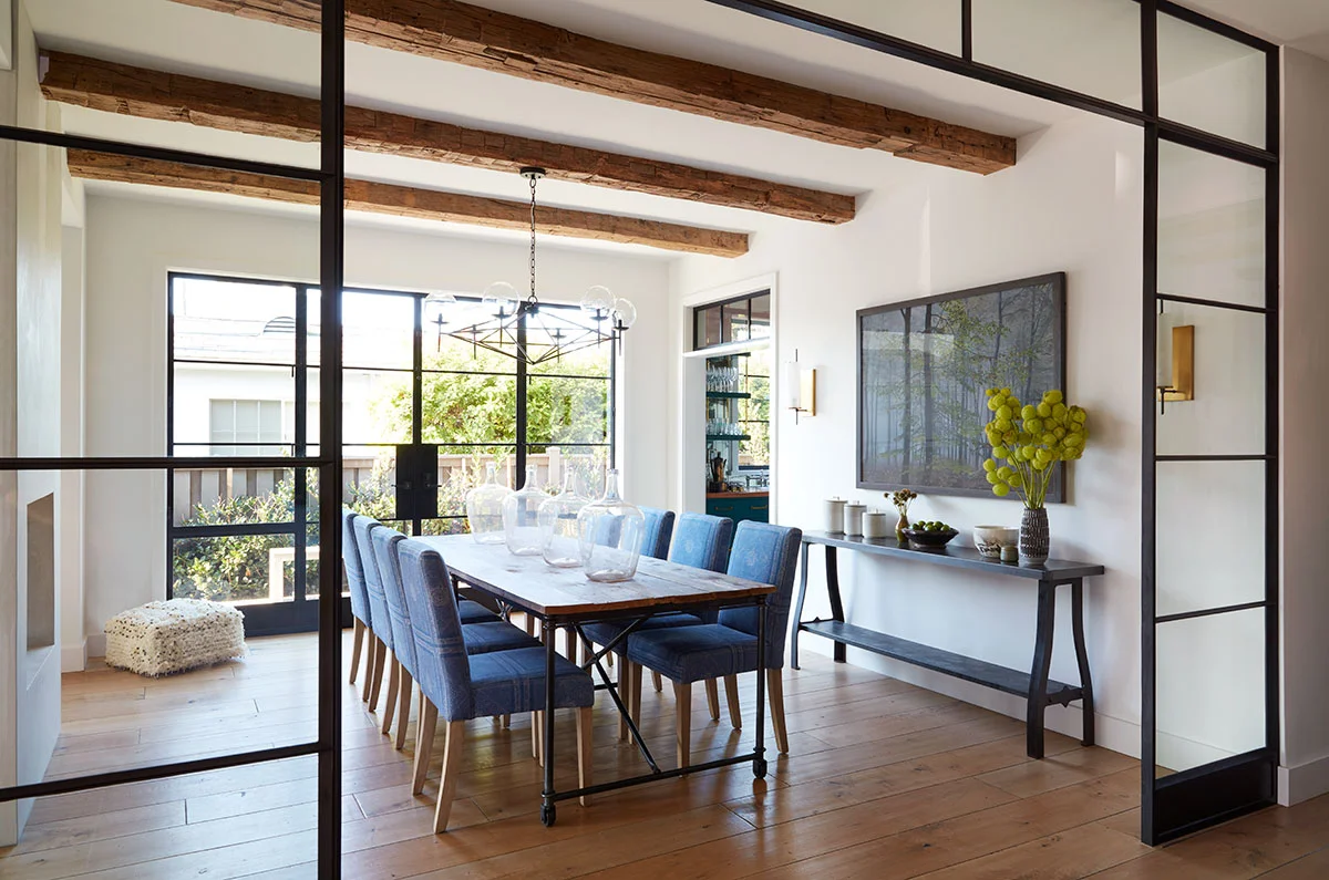 Modern-Farmhouse-Dining-Room-with-Steel-and-Glass-Dividers-and-Reclaimed-Wood-Ceiling-Beams-in-Venice-Beach-Designed-by-Carol-Allen-of-Studio-Allen-Architects-and-Kishani-Perera.jpg