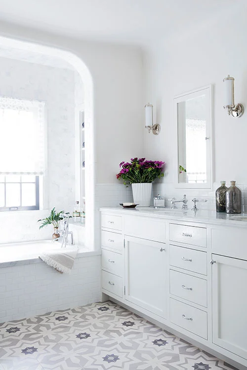 White-Master-Bath-with-Spanish-Floor-Tiles-Marble-Tub-Surround-and-White-Subway-Tile-Backsplash-Designed-by-Carol-Allen-of-Studio-Allen-Architects-and-Kishani-Perera.jpg