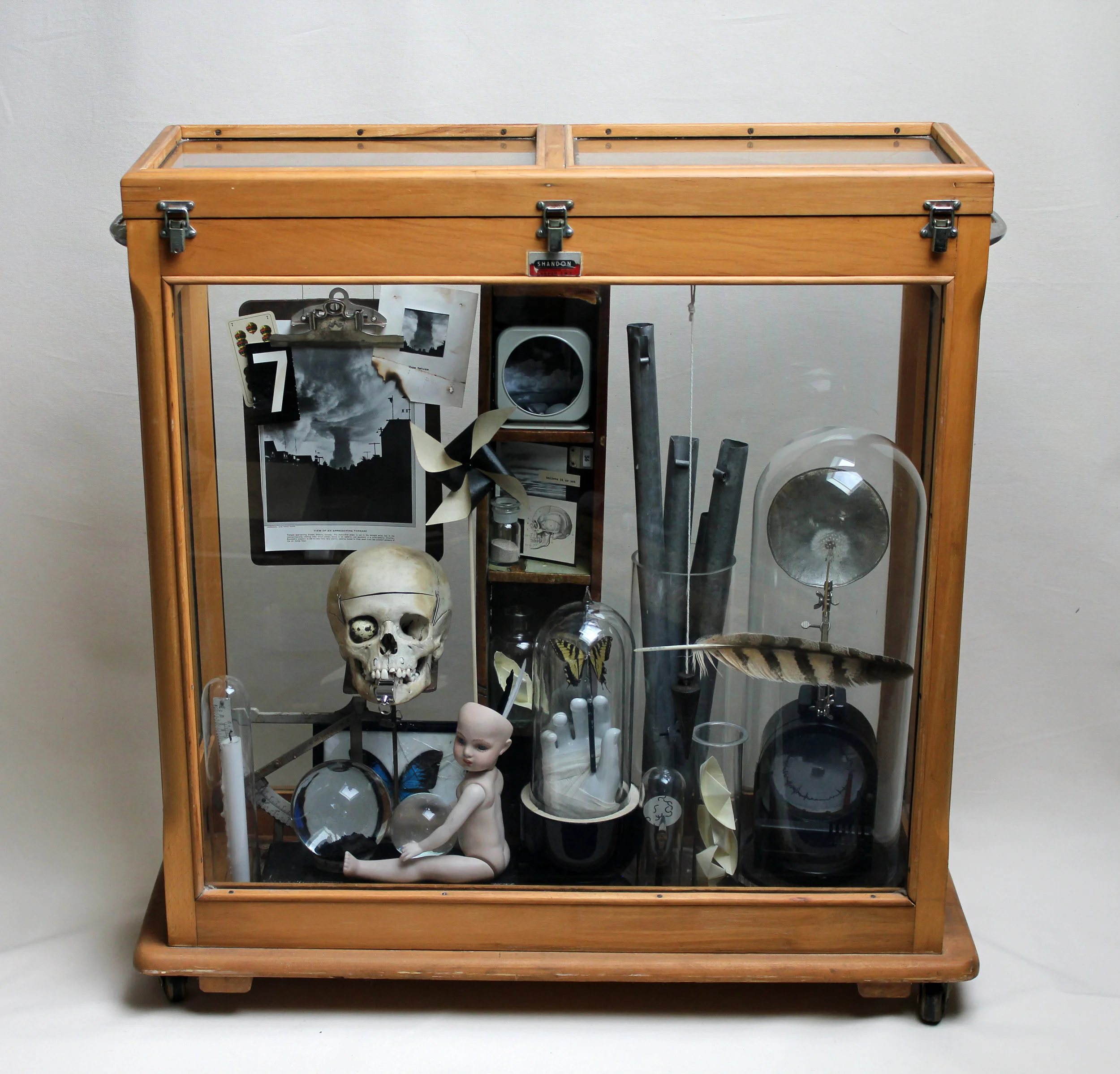 The Wind, Mixed media and found objects in vintage glass case. 36 x 12 x 37 inches, 2018