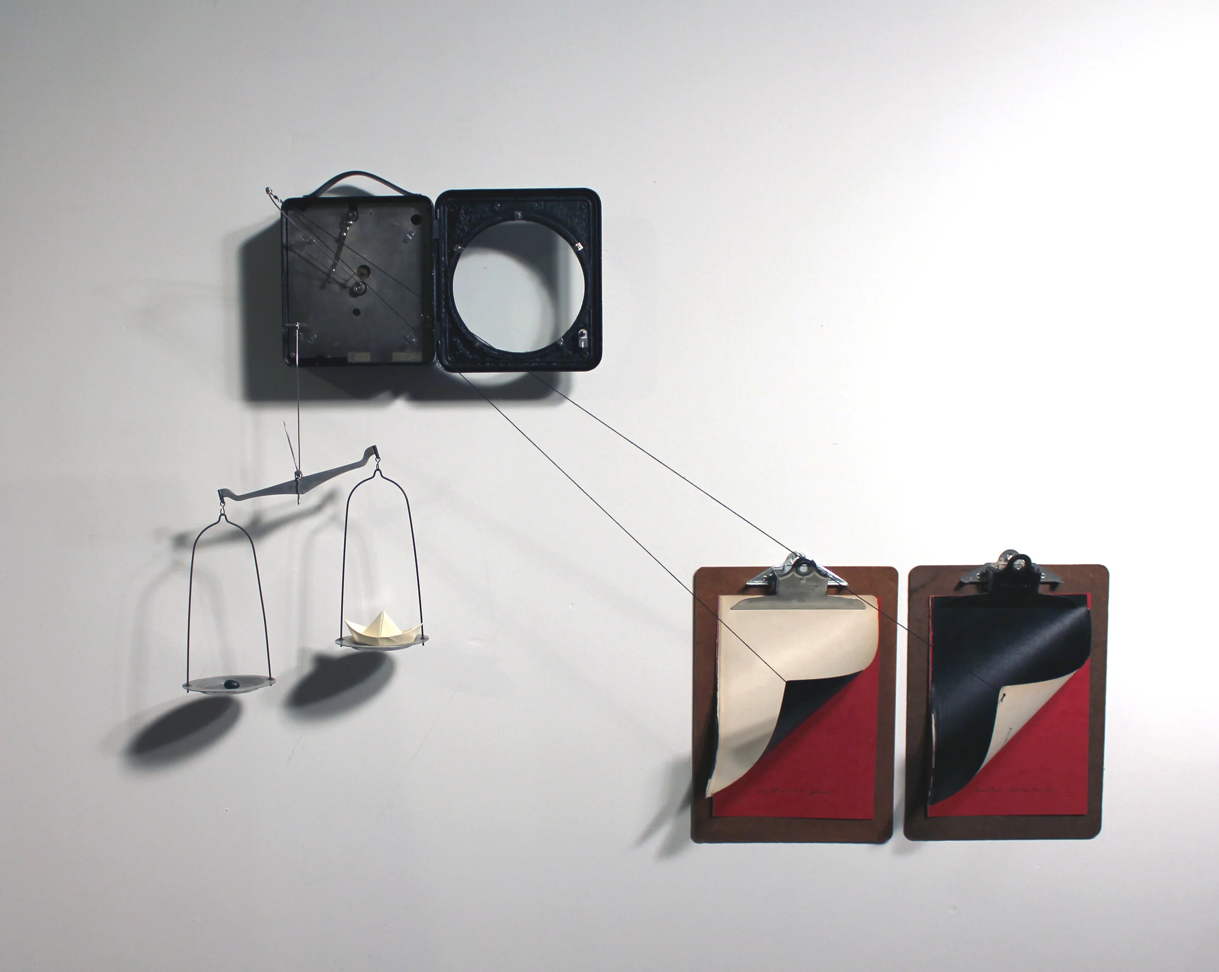 Another Hot Year, Vintage air pressure recording device, thread, wire, clipboards, and paper. (Kinetic sculpture: the pages are lifted gradually once every 24 hours.), 2016.