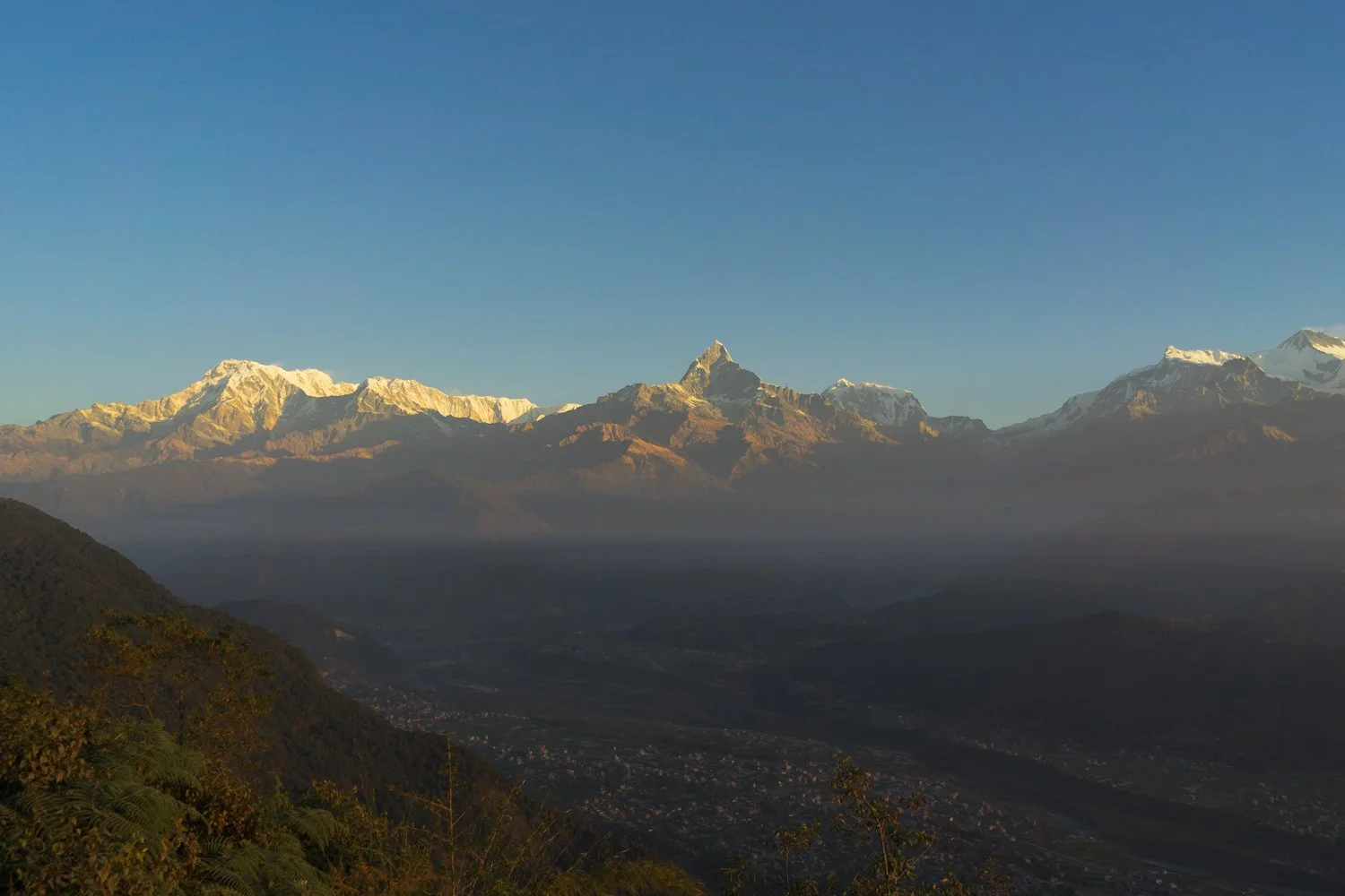 Dramatic mountain silhouettes in blue morning mist, edited with the V5 Misty Peak atmospheric landscape filter.
