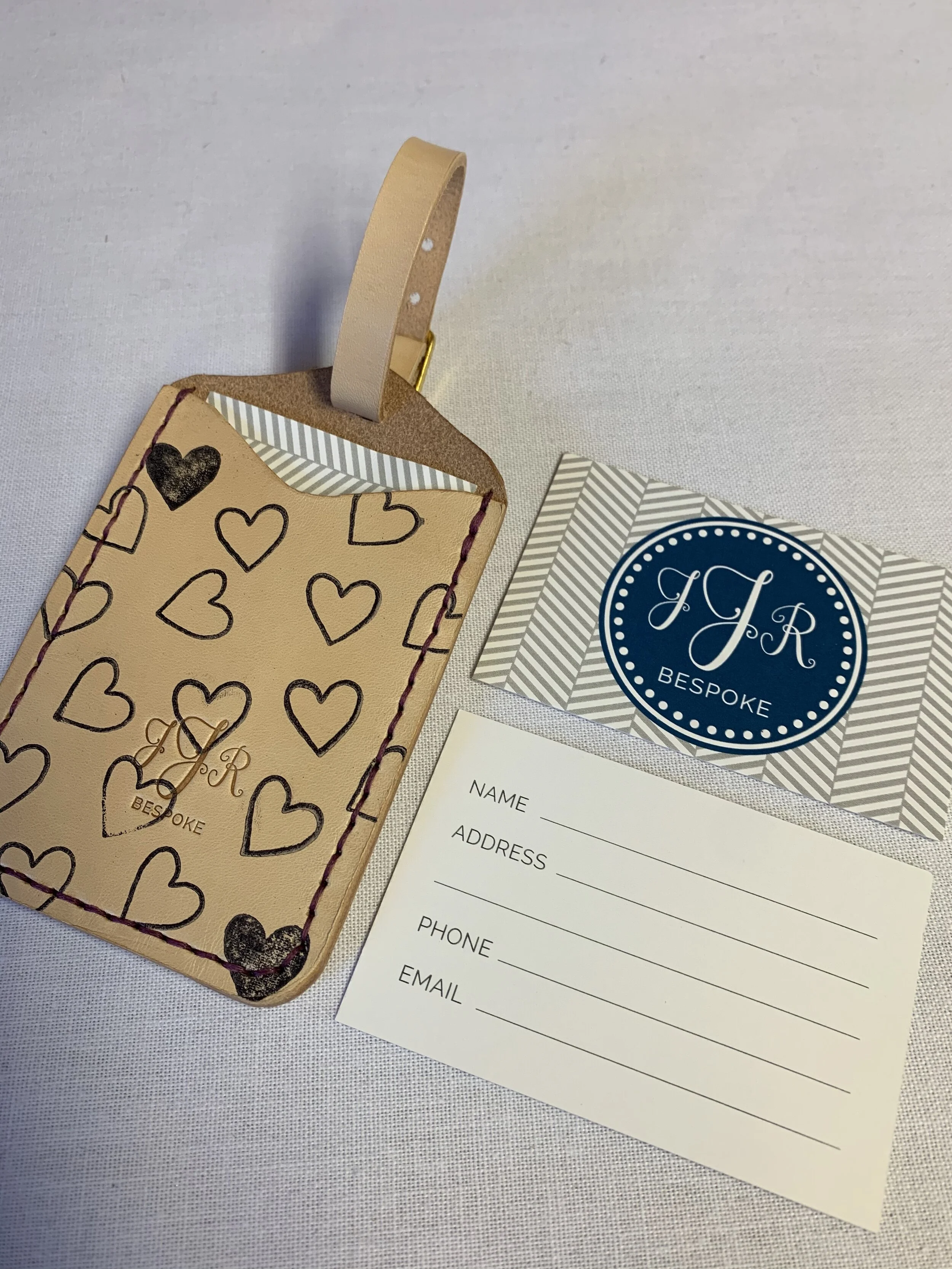 Limited edition Heart print luggage tag with purple stitching