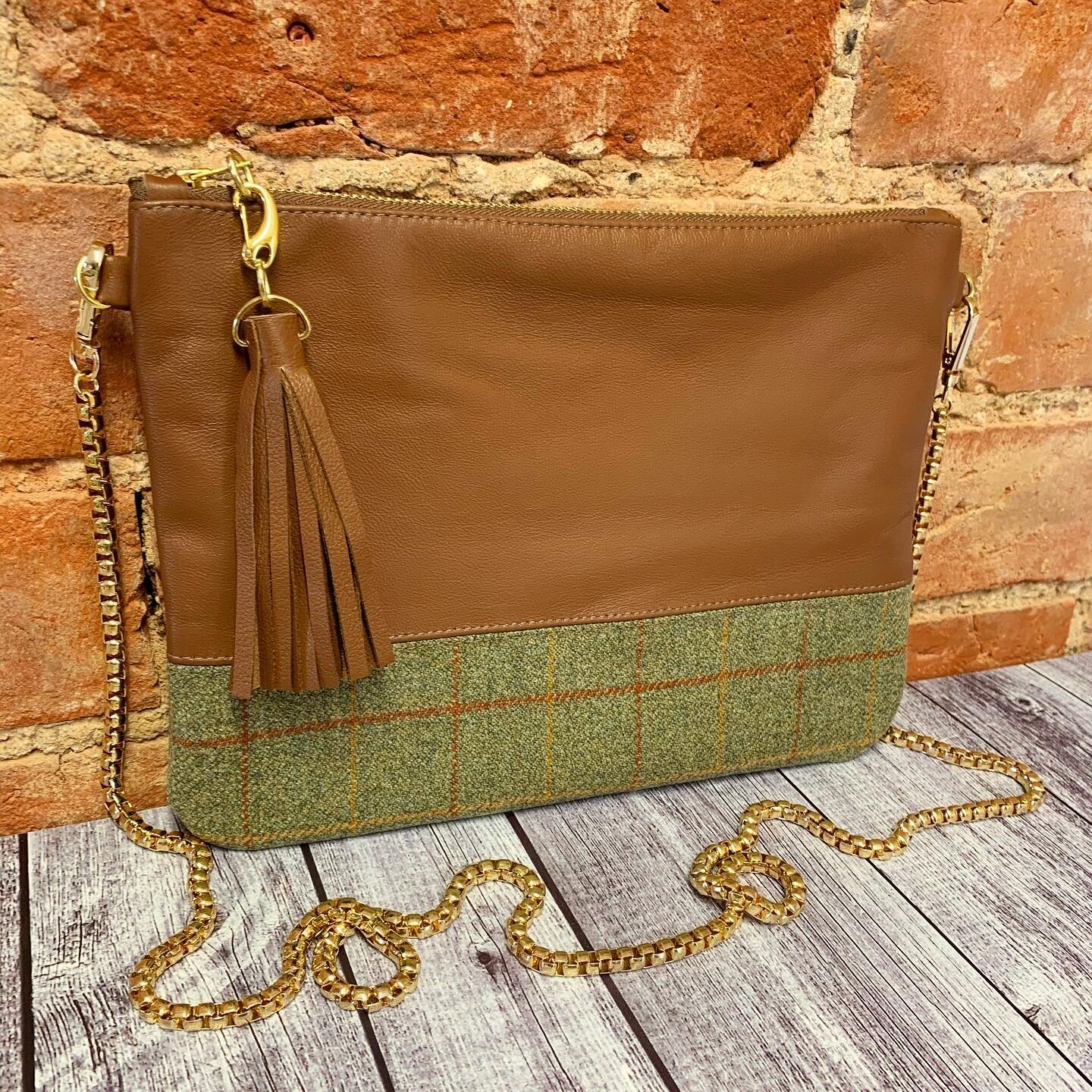 Tan leather and green with matching checked tweed clutch available on our website! www.jjrbespoke.com 
Comes with detachable shoulder chain and leather tassel, all finished off with gold hardware! 💚🤎