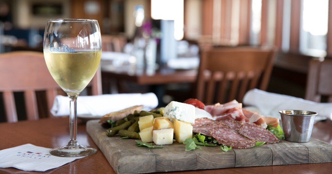 It's a good day to dine inside with us, have a glass of wine, and share a charcuterie board with friends.