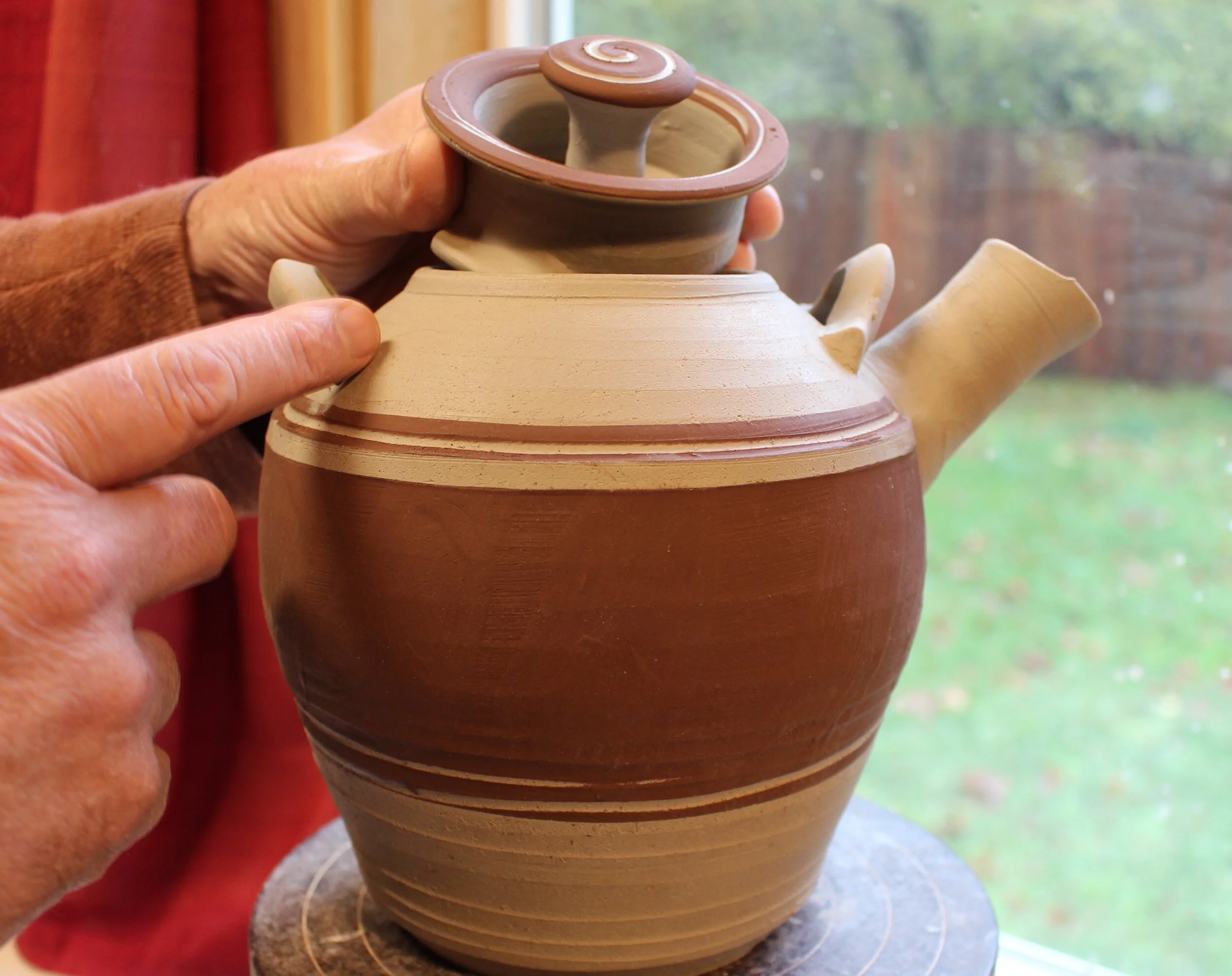 Pottery Teapot Lid being fitted