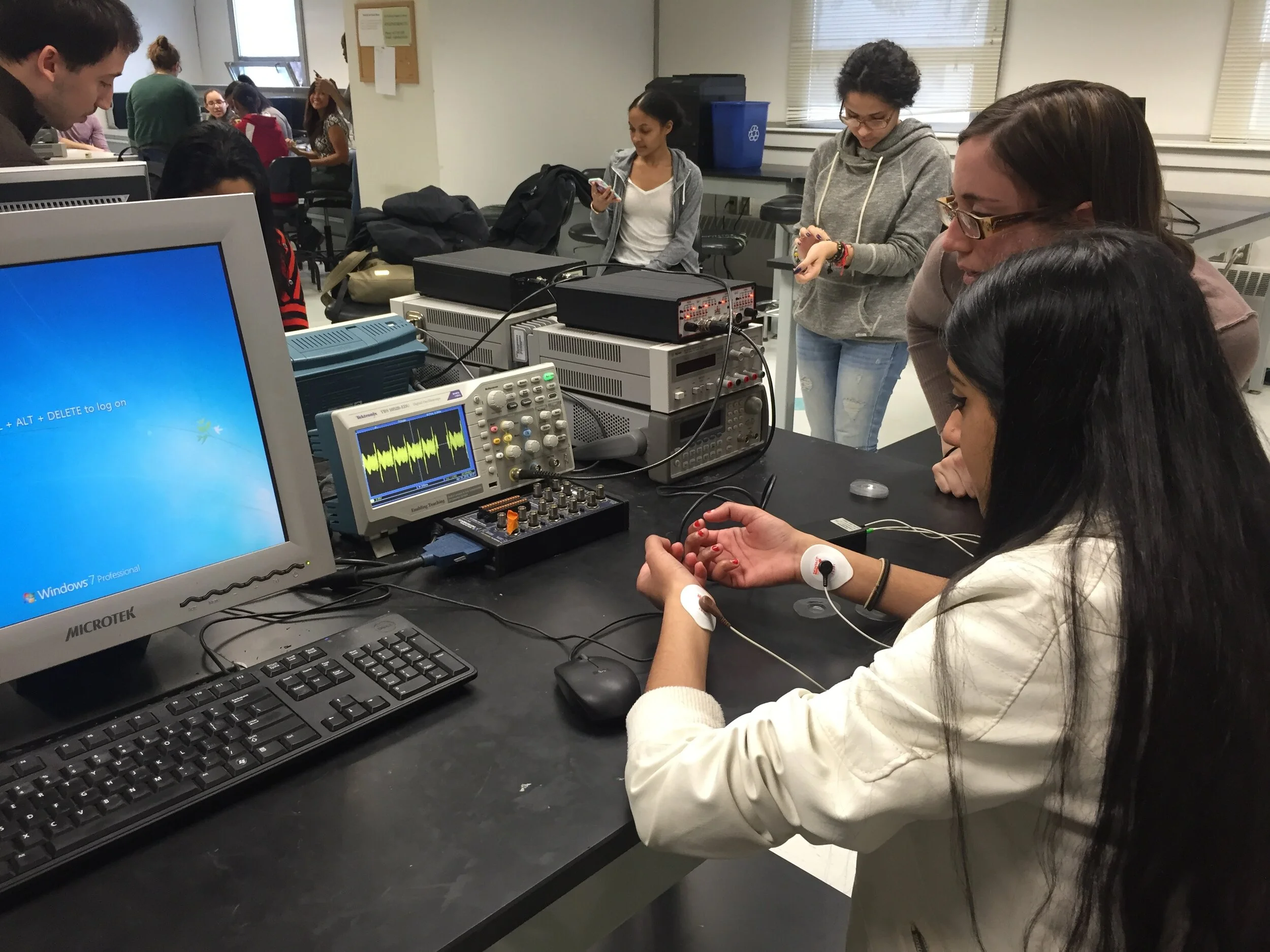 High schoolers making their own EKGs with an oscilloscope